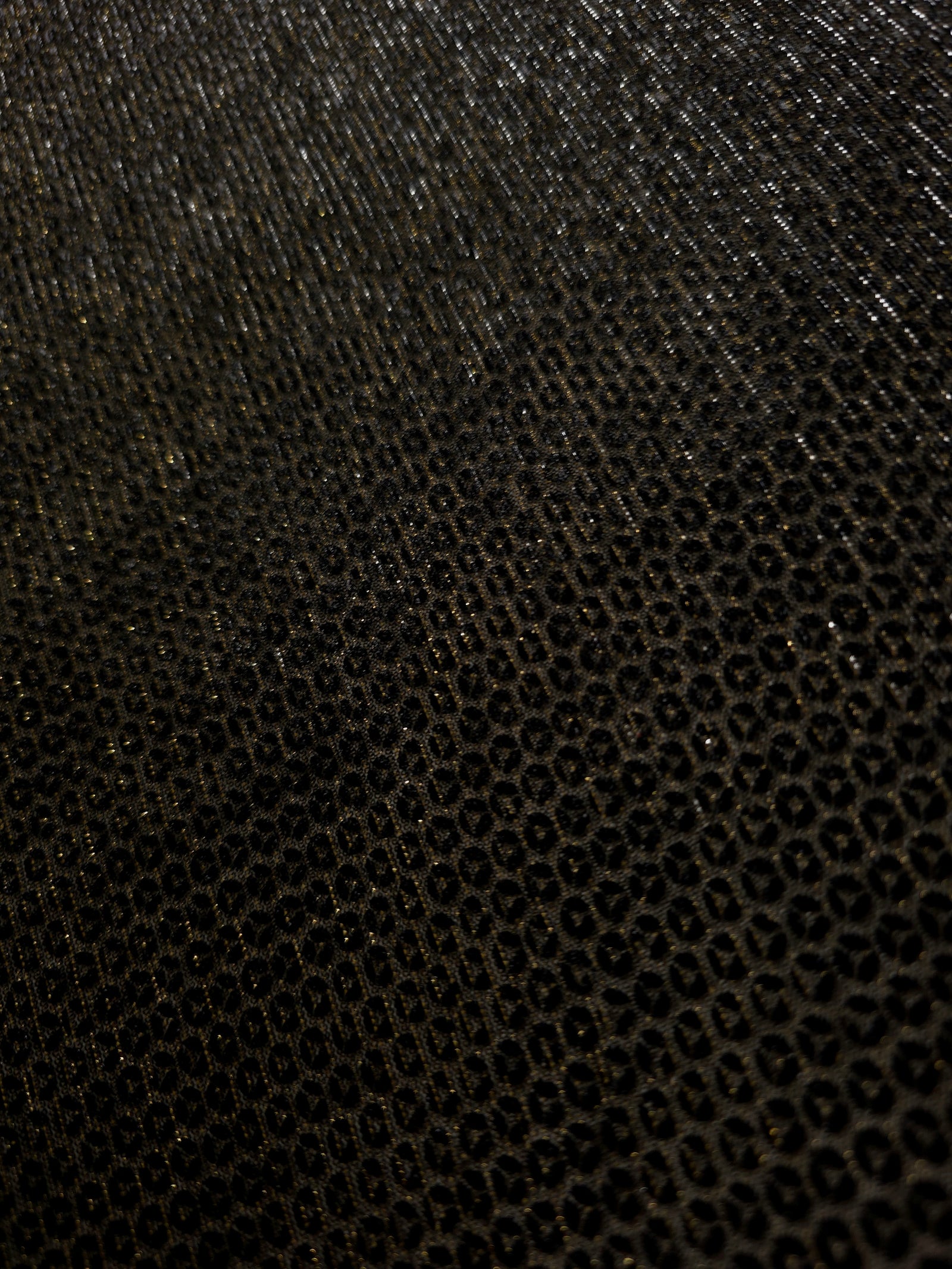 Close-up of Olive Gold Sheer Circle Shimmer Stretch Tulle Fabric revealing the circular shimmer repeat and fine sheer mesh