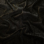 Draped Olive Gold Sheer Circle Shimmer Stretch Tulle Fabric showing reflective round motifs across soft fluid folds