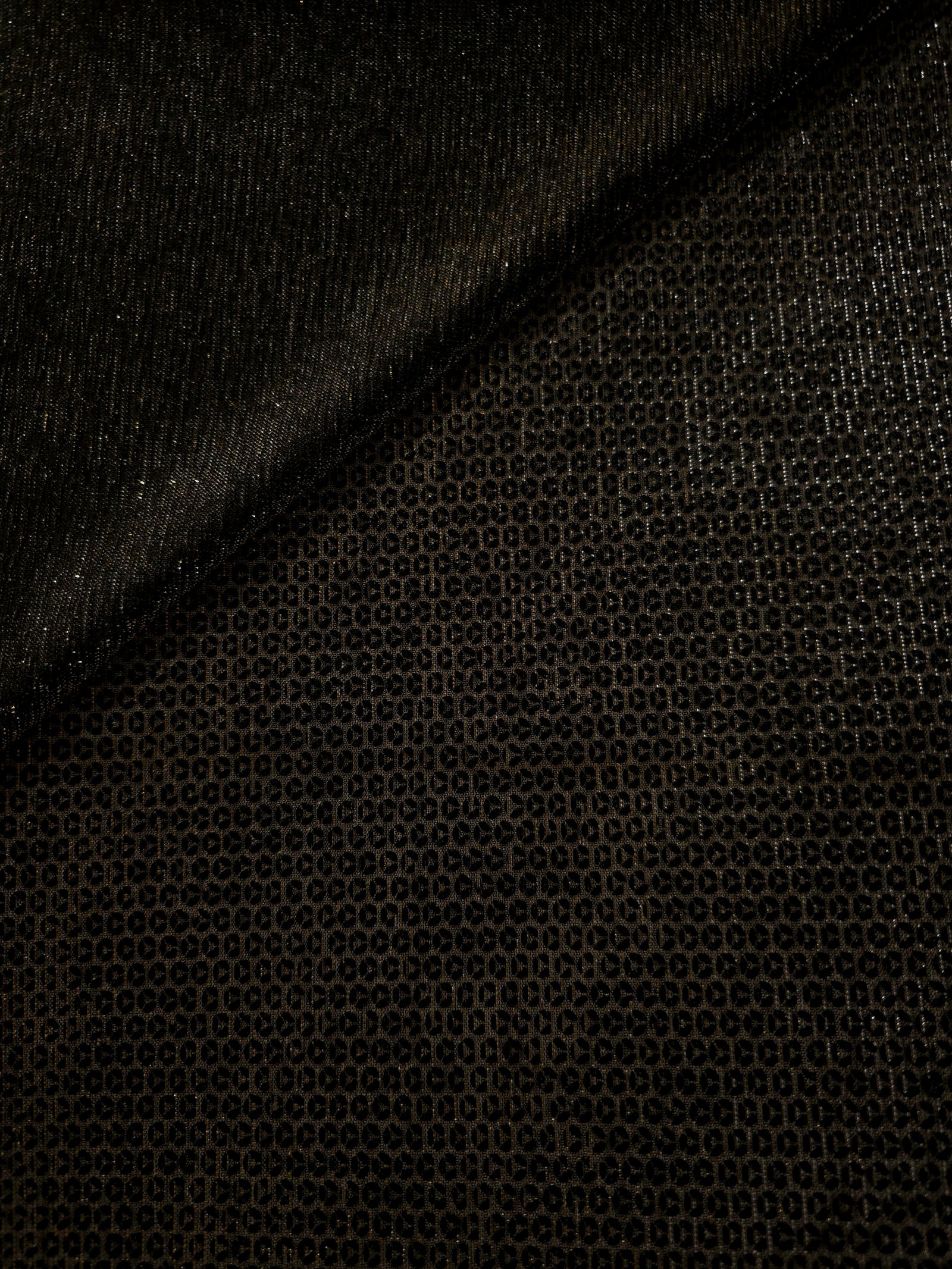 Front and back of Olive Gold Sheer Circle Shimmer Stretch Tulle Fabric showing transparent knit structure, circle motif and stretch