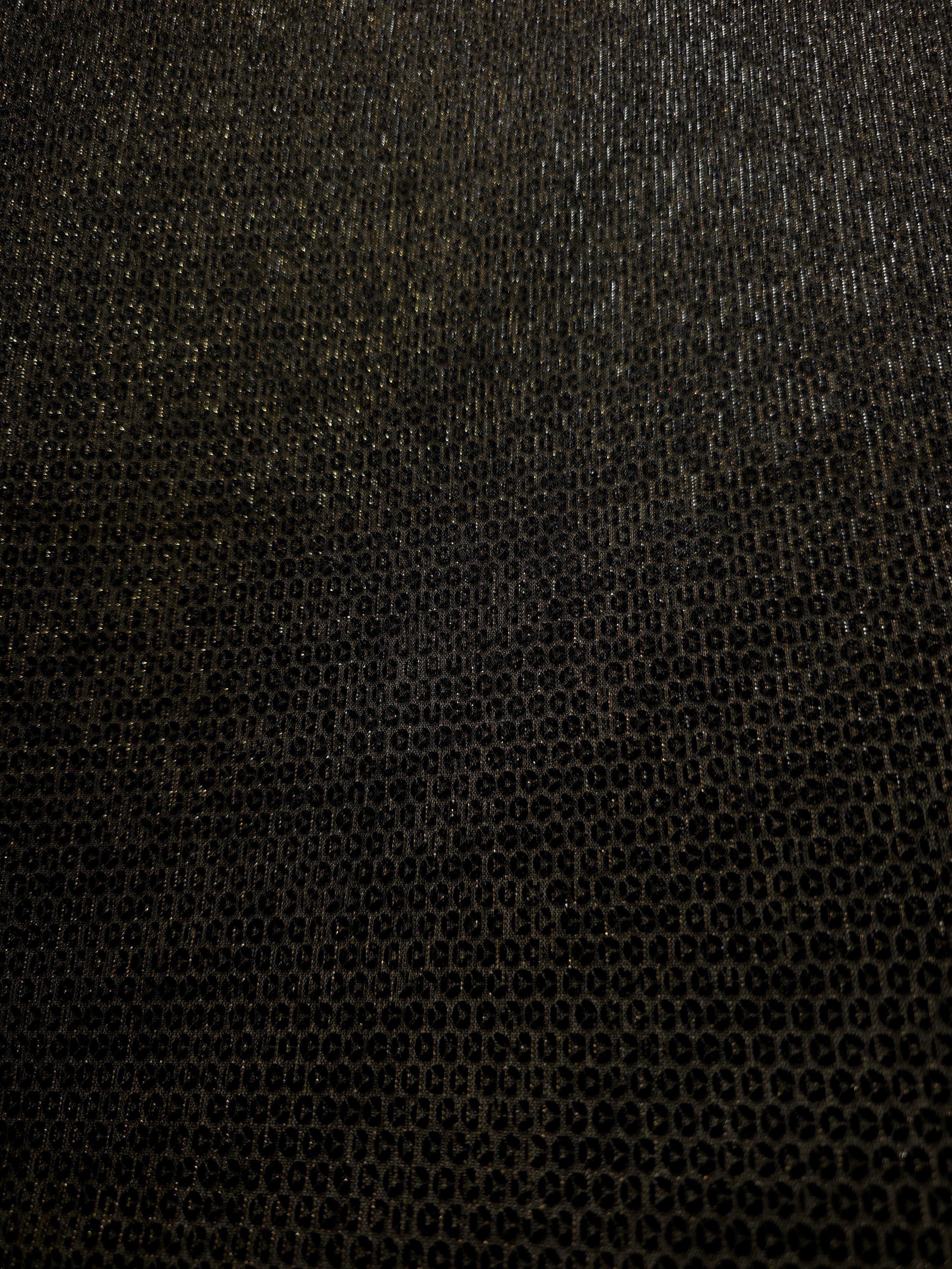 Surface detail of Olive Gold Sheer Circle Shimmer Stretch Tulle Fabric highlighting reflective circle scale and lightweight tulle texture