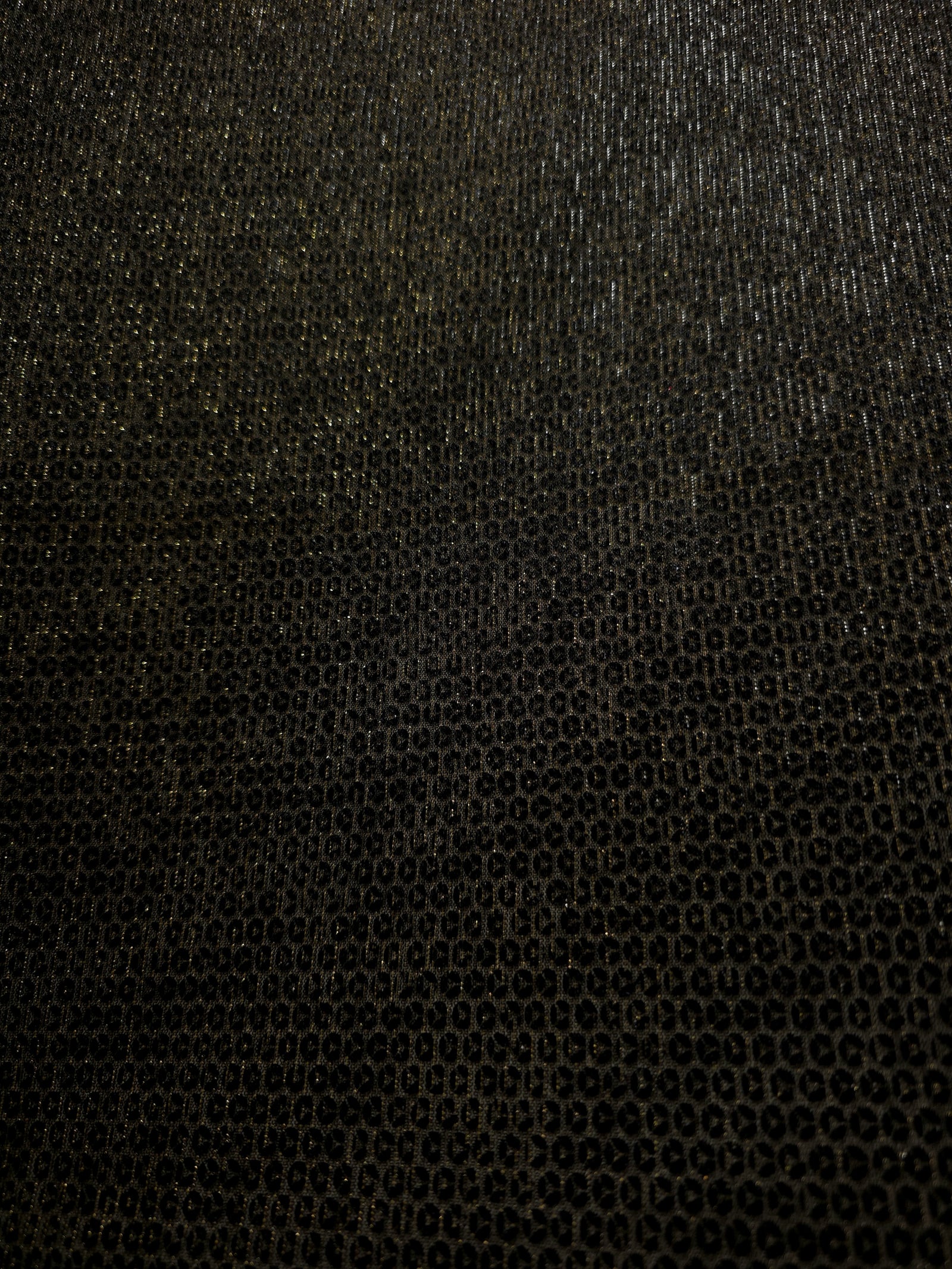 Surface detail of Olive Gold Sheer Circle Shimmer Stretch Tulle Fabric highlighting reflective circle scale and lightweight tulle texture