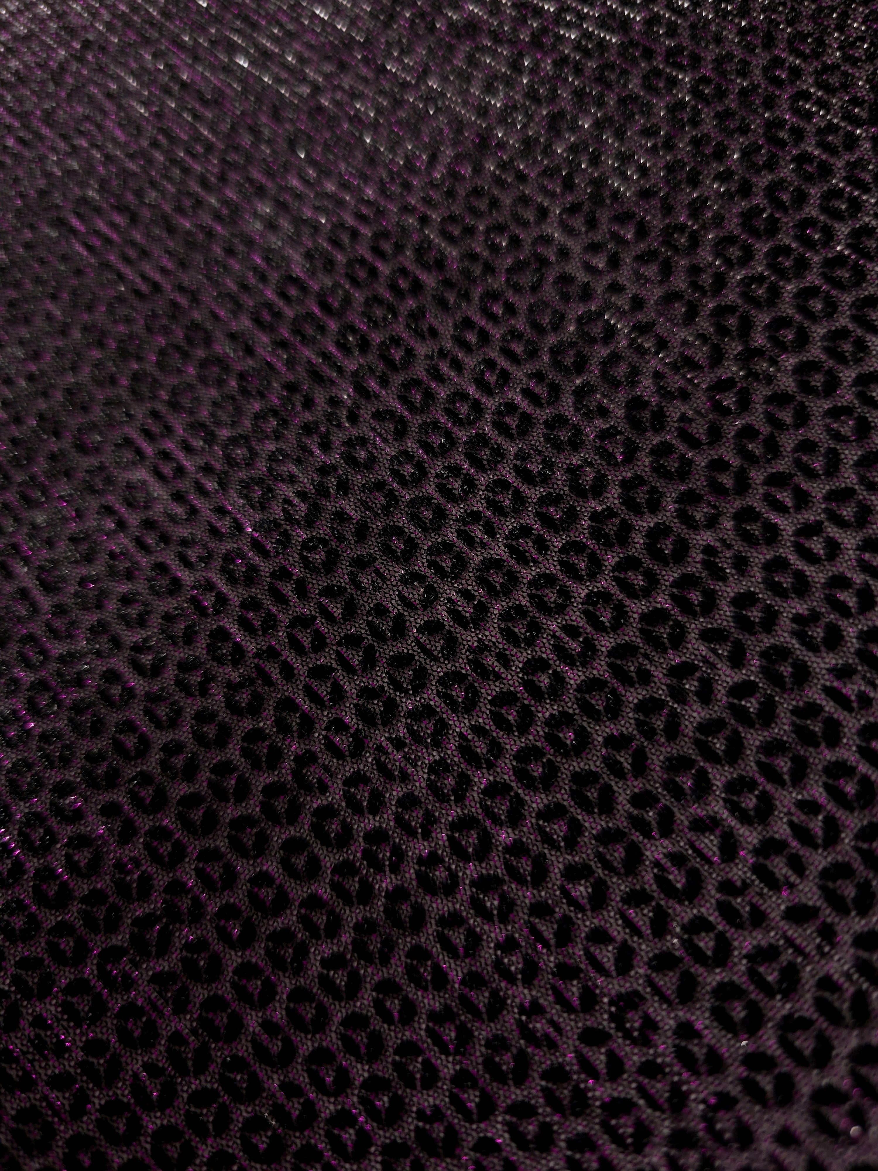 Close-up of Plum Violet Sheer Circle Shimmer Stretch Tulle Fabric revealing the circular shimmer repeat and fine sheer mesh