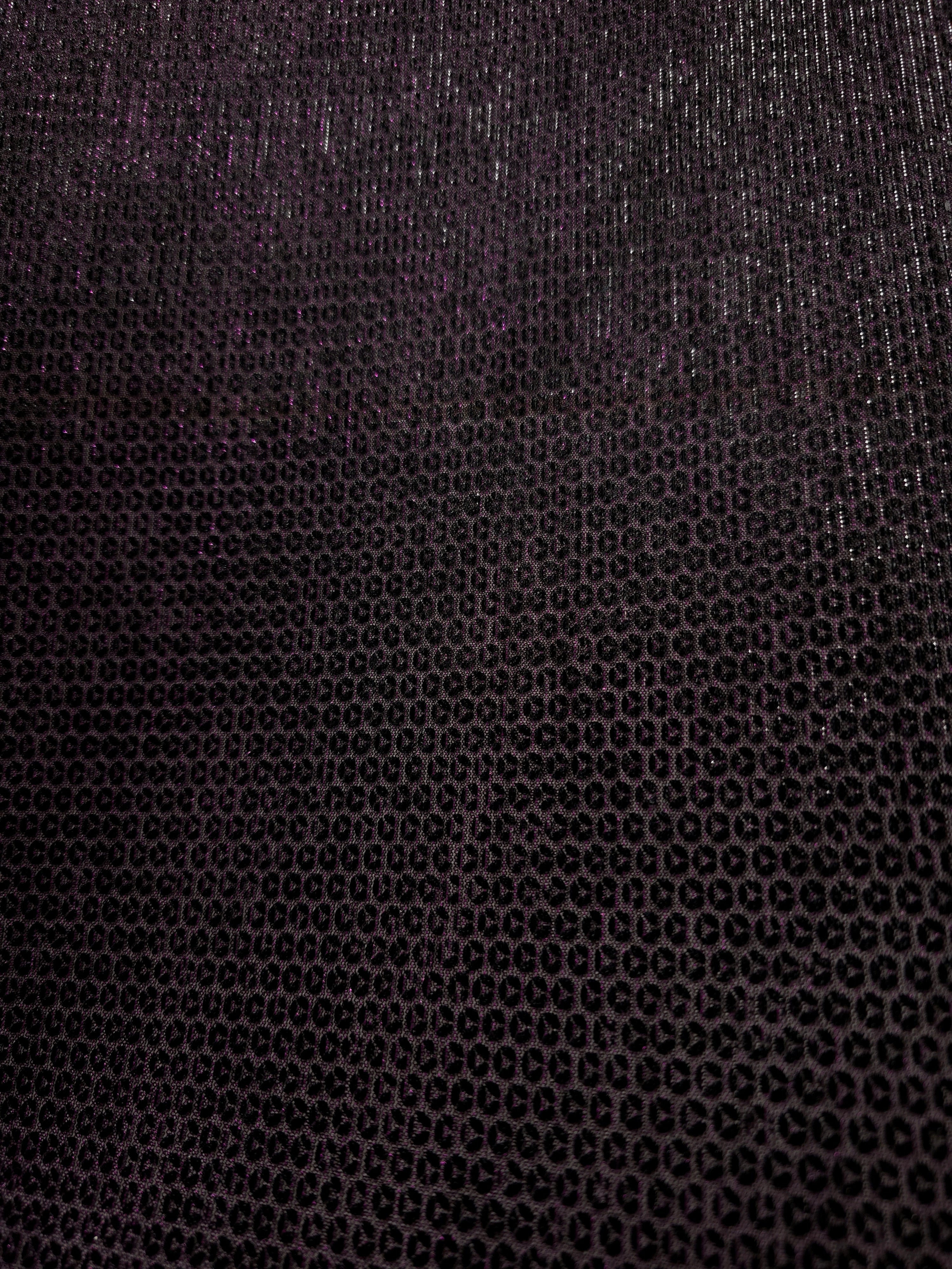 Surface detail of Plum Violet Sheer Circle Shimmer Stretch Tulle Fabric highlighting reflective circle scale and lightweight tulle texture
