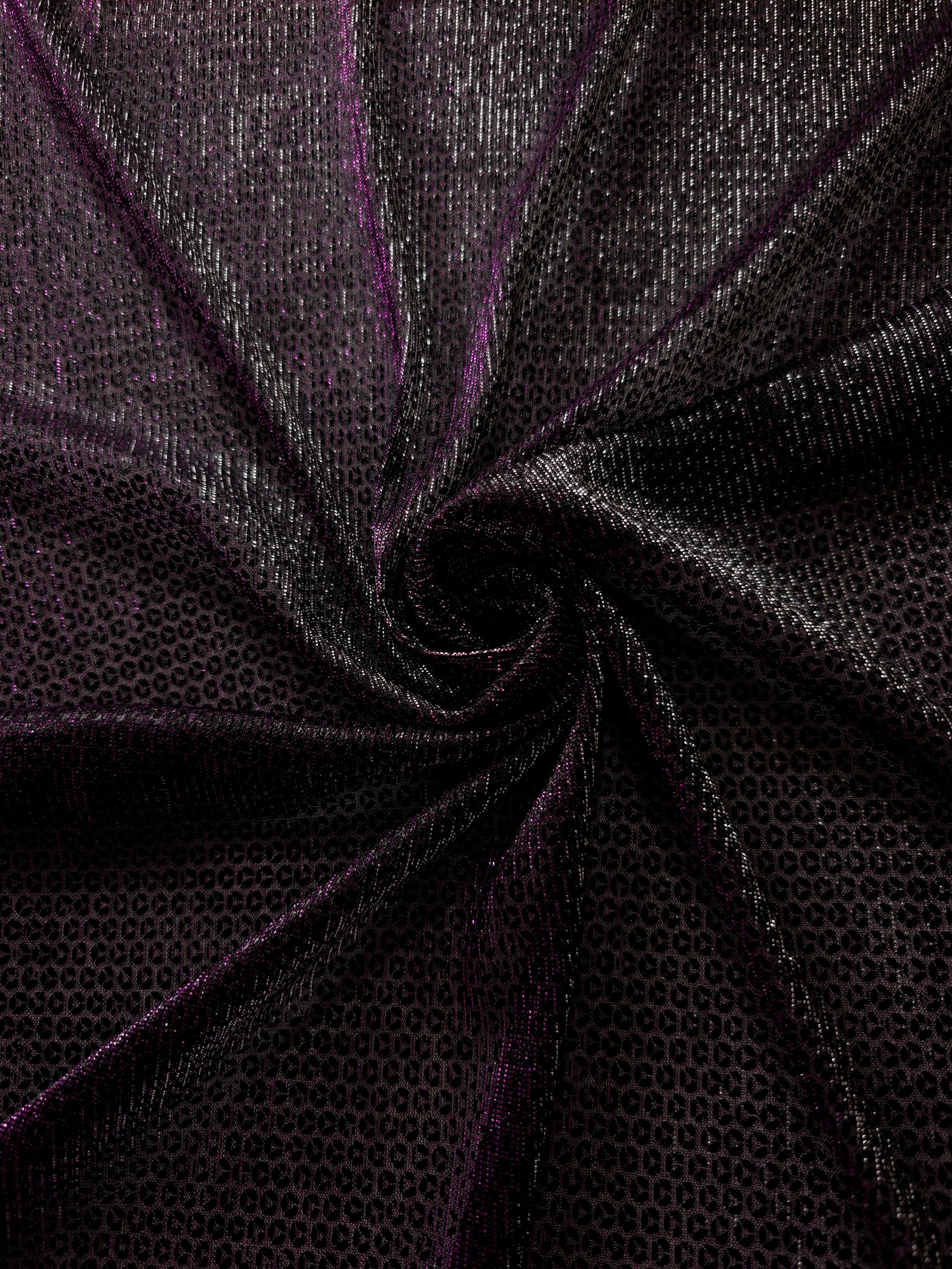 Swirl-draped Plum Violet Sheer Circle Shimmer Stretch Tulle Fabric showing circular highlights shifting through flexible movement