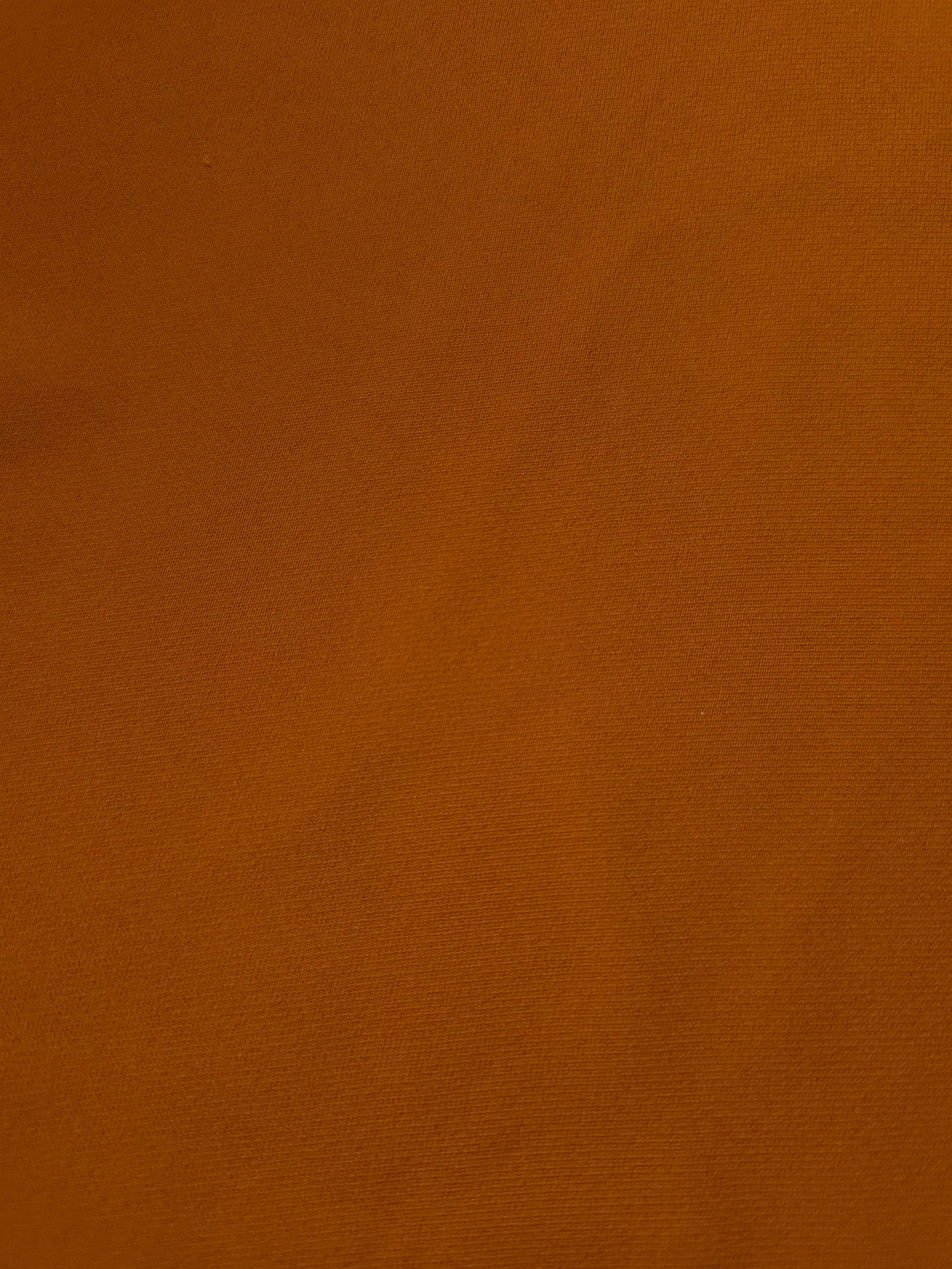 Close-up of Cognac Brown mechanical polyester crepe showing fine woven texture and a smooth silky-soft hand