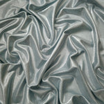 Cool Silver Gray metallic stretch fabric arranged in elegant folds, showing reflective movement for occasionwear, costumes and fashion design