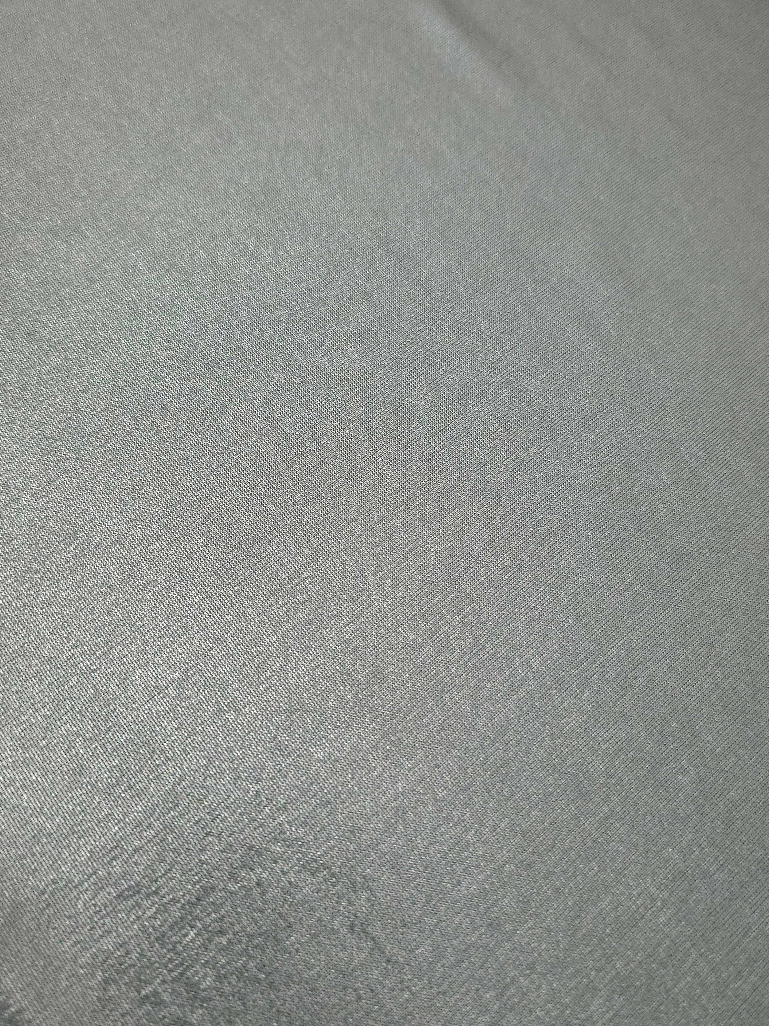 Close-up Cool Silver Gray shimmer metallic spandex showing reflective foil detail and the fabric surface for statement garments