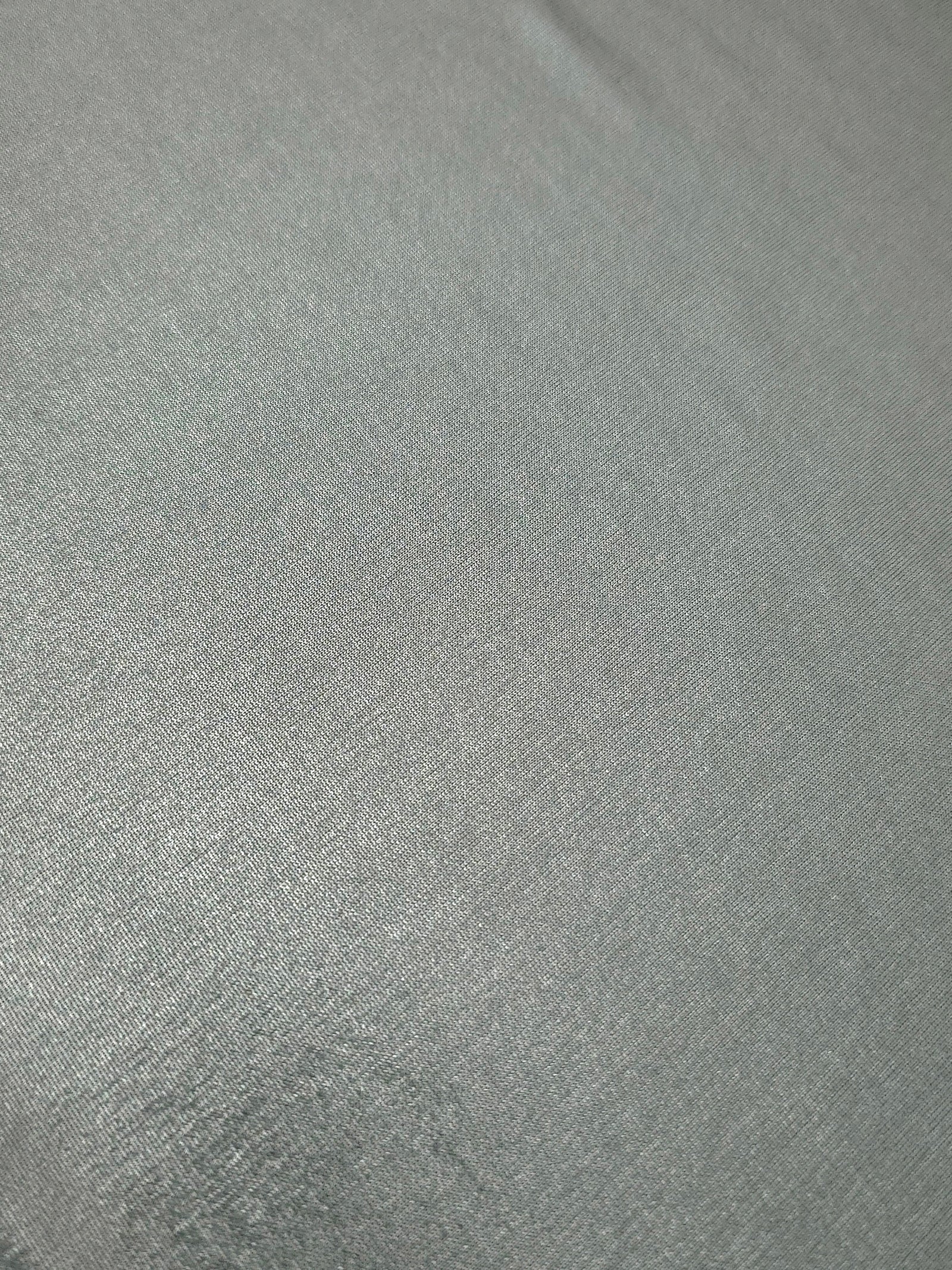 Close-up Cool Silver Gray shimmer metallic spandex showing reflective foil detail and the fabric surface for statement garments