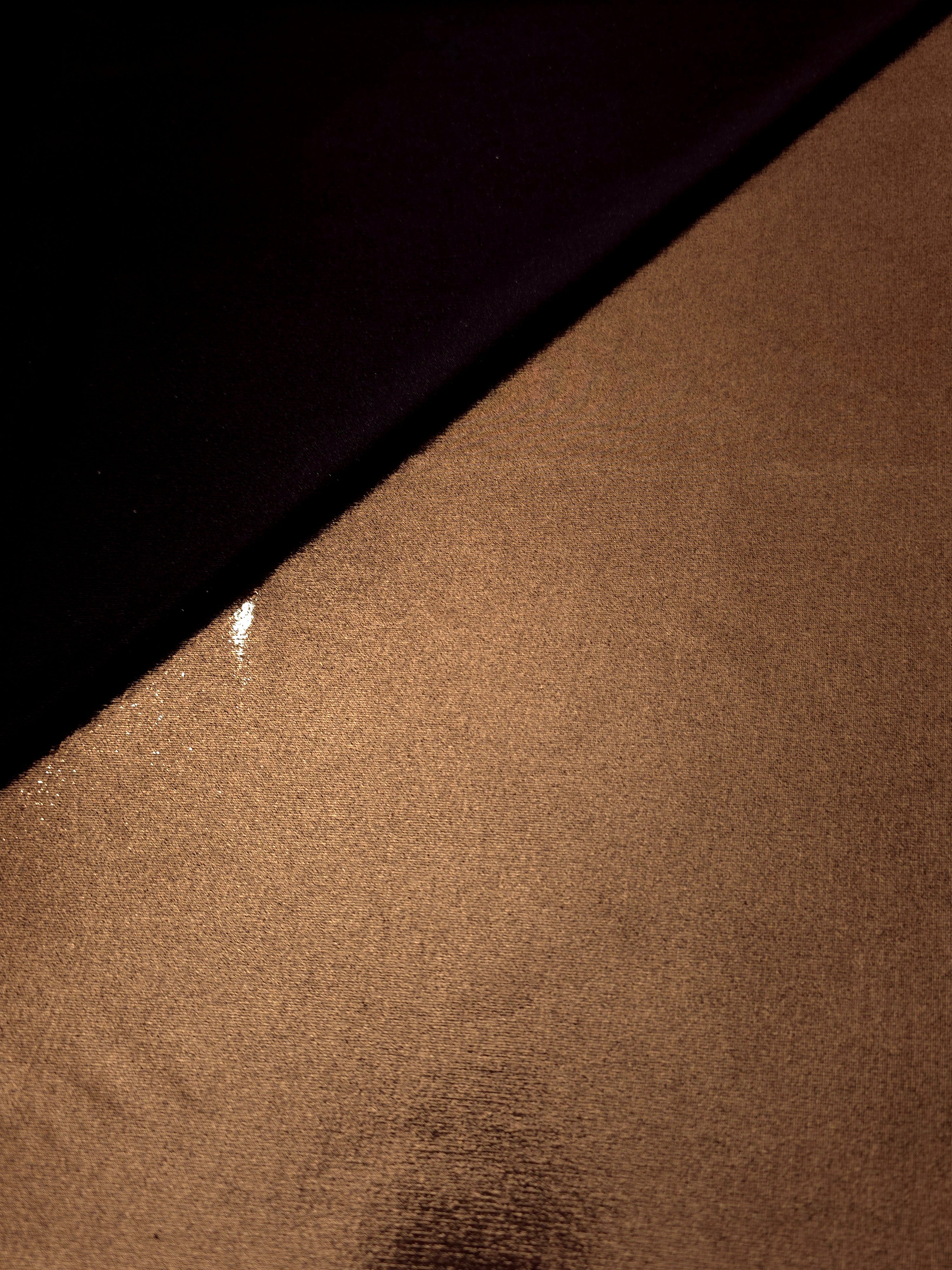 Copper Brown shimmer spandex in a soft fold, showing metallic foil sheen and flexible drape for tops, skirts and costumes