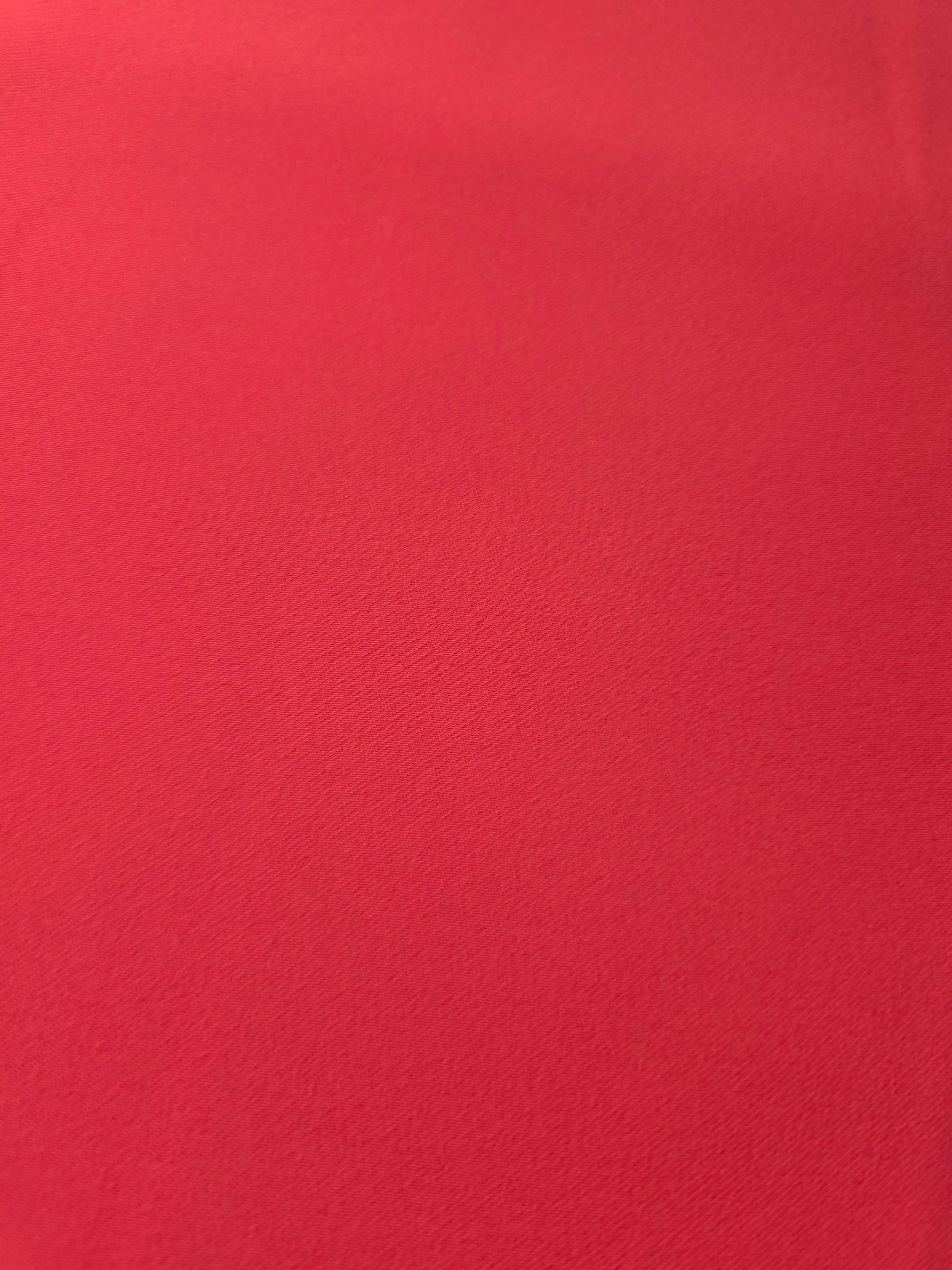 Close woven detail of Crimson Red polyester crepe showing smooth texture and a refined silky-feel finish