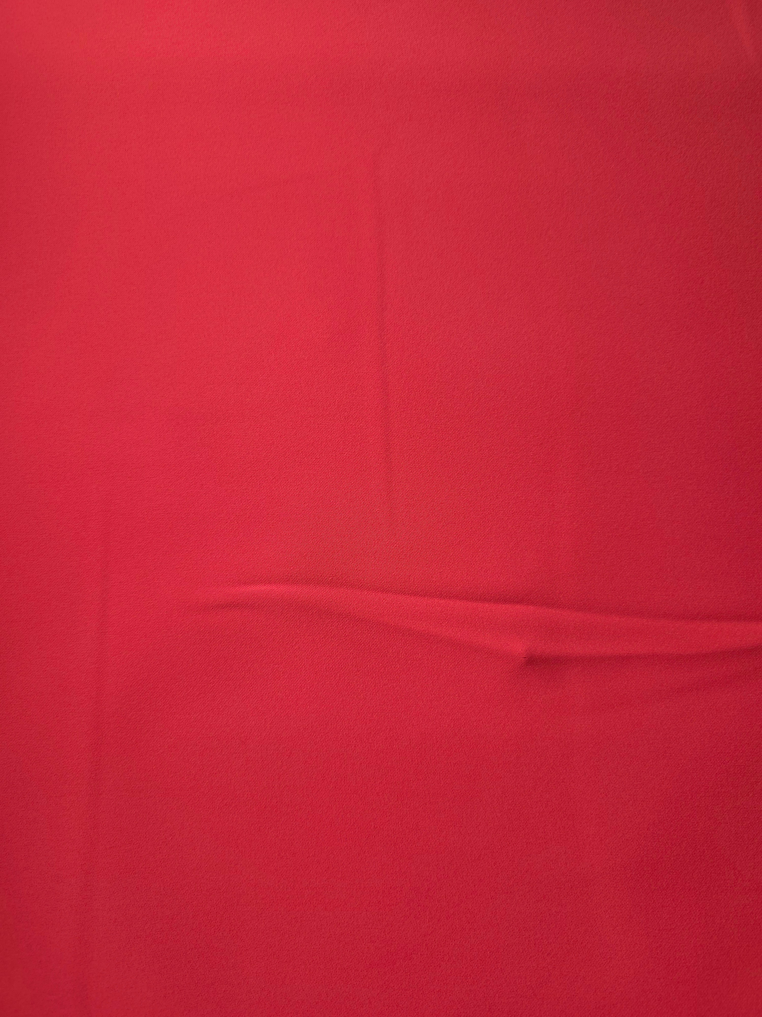 Surface view of Crimson Red Italian polyester crepe, smooth woven fabric for dresses, blouses and separates