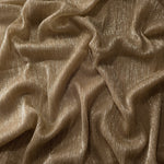 Draped Antique Taupe Gold Sheer Metallic Shimmer Stretch Tulle Fabric showing luminous reflective folds, soft transparency and flexible flow for dresses, dancewear, stagewear and occasion looks