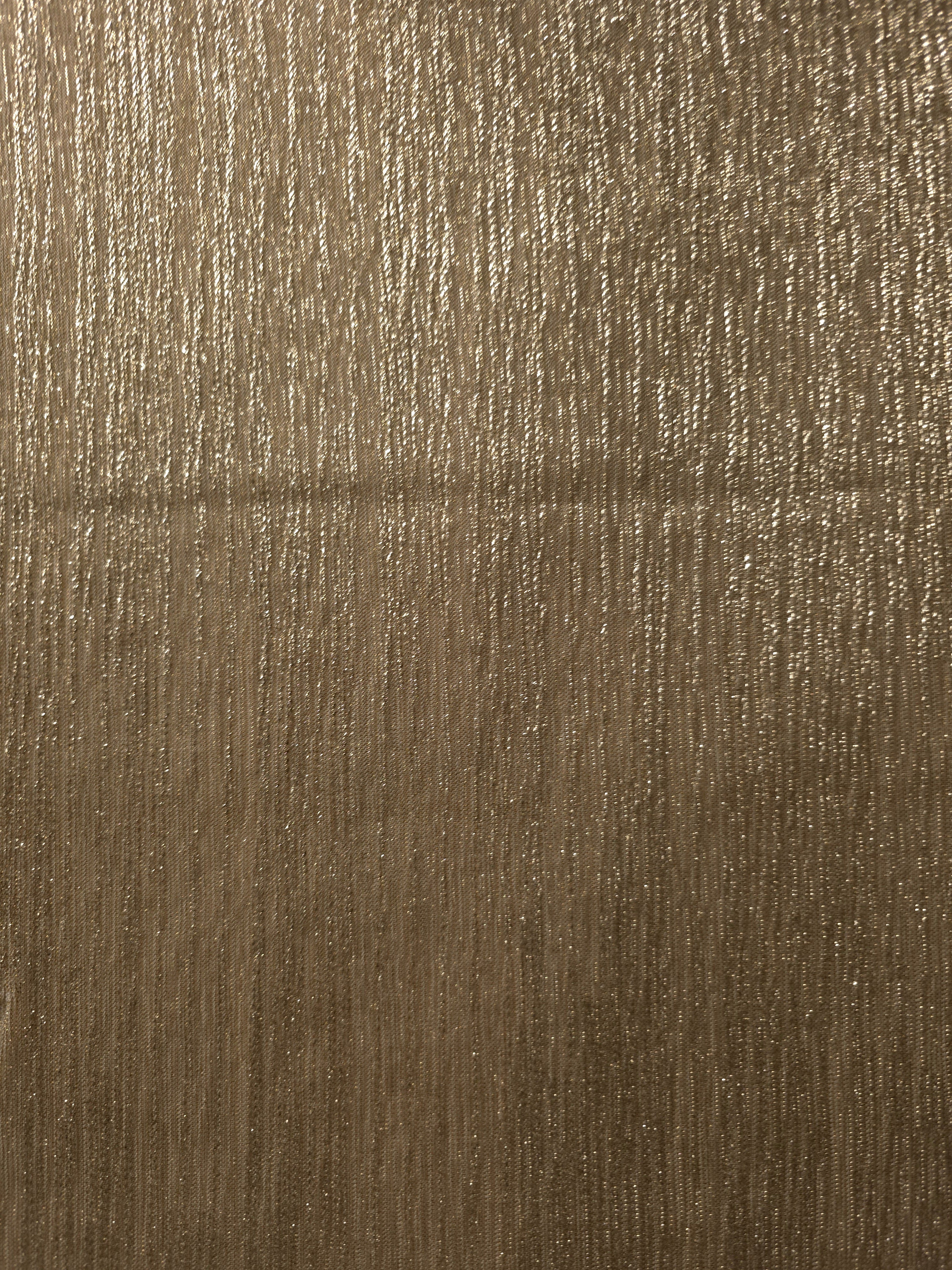 Surface view of Antique Taupe Gold Sheer Metallic Shimmer Stretch Tulle Fabric showing even metallic shimmer, fine sheer tulle texture, translucent finish and stretch for overlays, dresses and performance wear