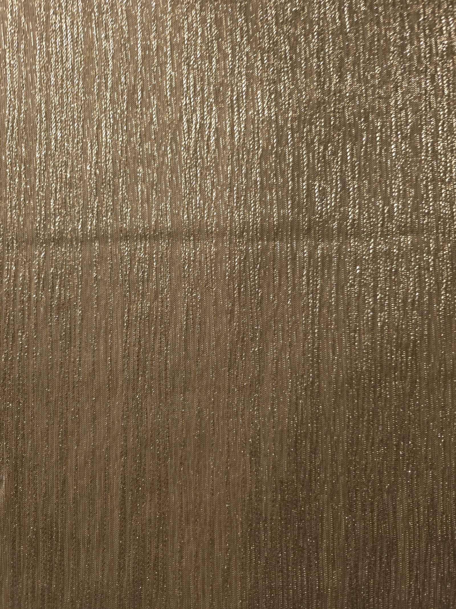 Surface view of Antique Taupe Gold Sheer Metallic Shimmer Stretch Tulle Fabric showing even metallic shimmer, fine sheer tulle texture, translucent finish and stretch for overlays, dresses and performance wear