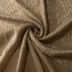 Swirl-draped Antique Taupe Gold Sheer Metallic Shimmer Stretch Tulle Fabric showing fluid movement, reflective shimmer, airy transparency and flexible stretch for dresses, dancewear and stage looks