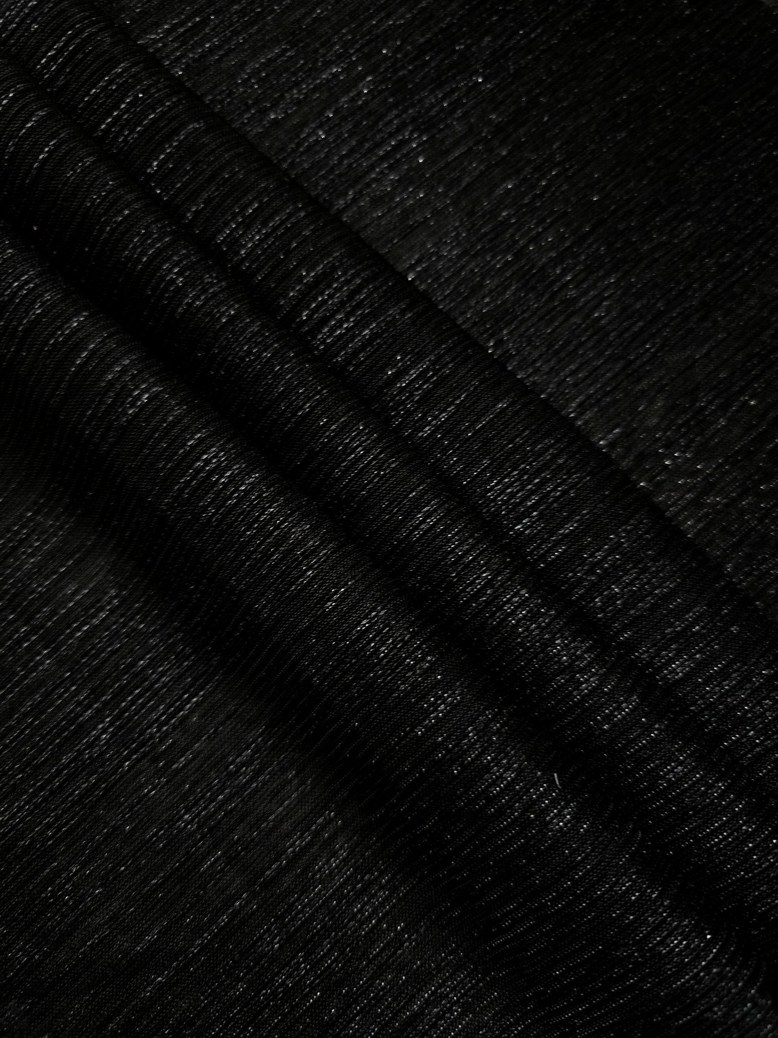 Layered Charcoal Black Sheer Metallic Shimmer Stretch Tulle Fabric showing shimmering depth, soft transparency and airy flexible folds for eveningwear, overlays, costumes and stagewear