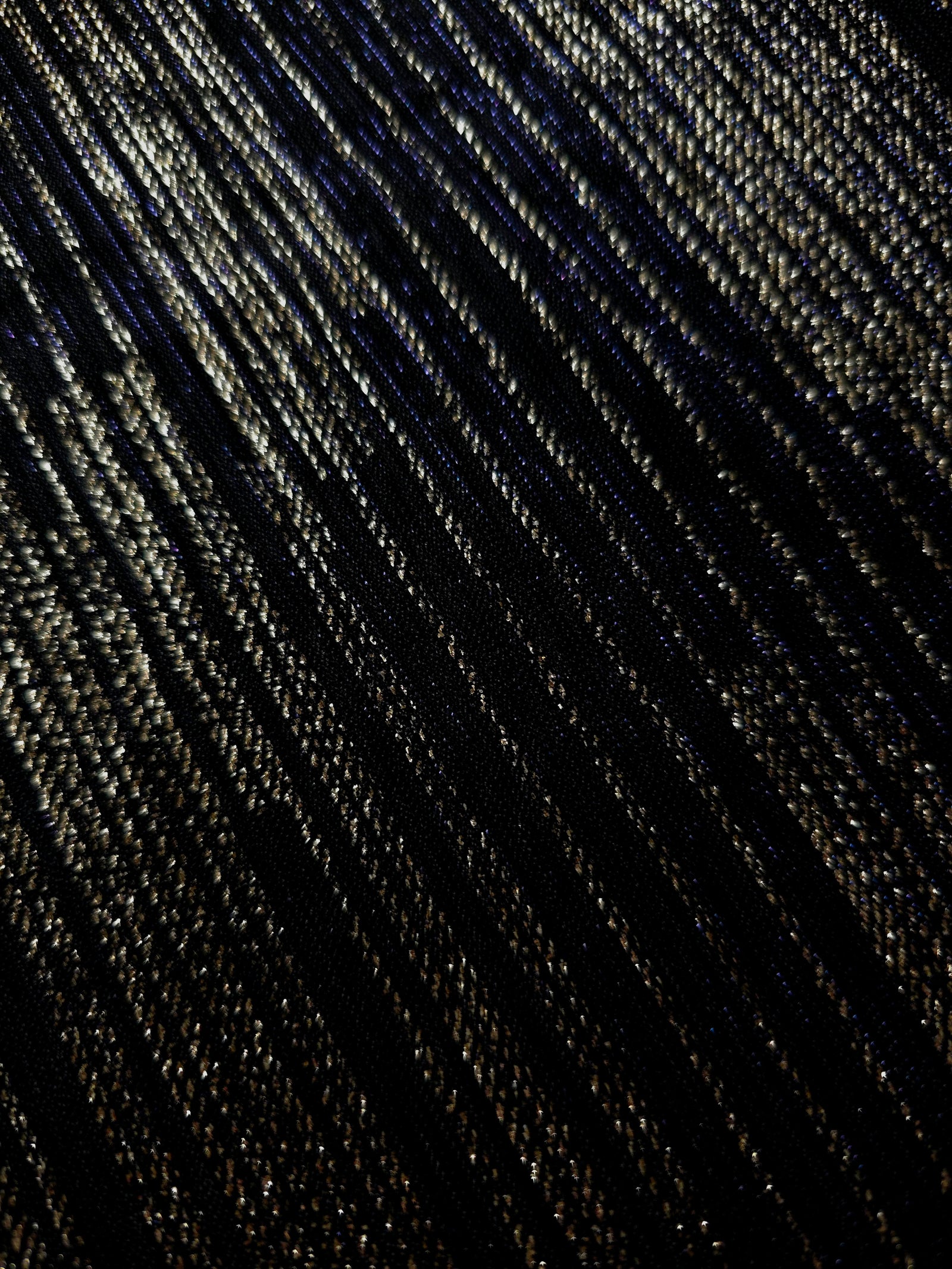 Close-up of Jet Black Sheer Metallic Shimmer Stretch Tulle Fabric highlighting fine sheer mesh texture, metallic shimmer, lightweight stretch and subtle transparency for fashion and performance wear