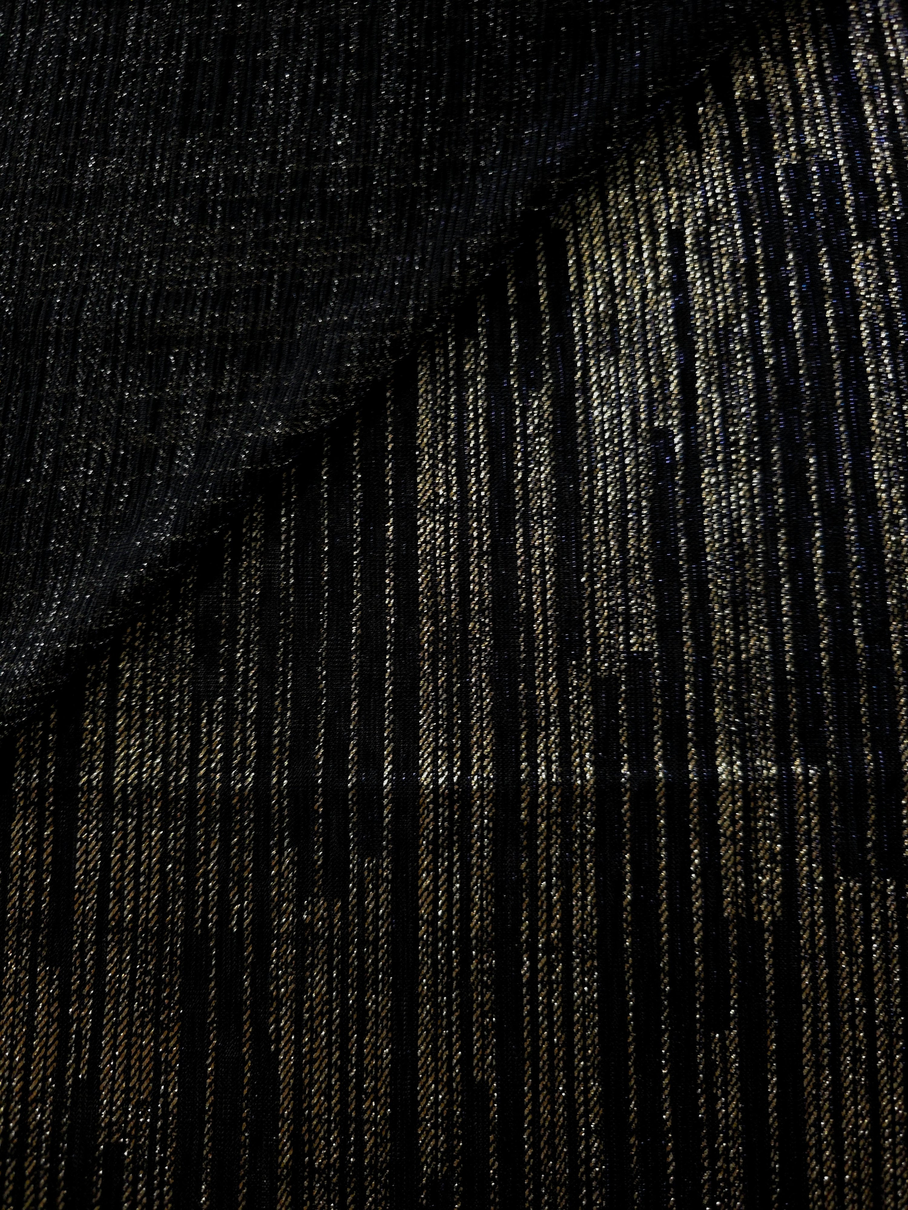 Jet Black Sheer Metallic Shimmer Stretch Tulle Fabric shown front and back, revealing reflective metallic shimmer, translucent mesh structure and flexible stretch for layered garments, costumes and dancewear