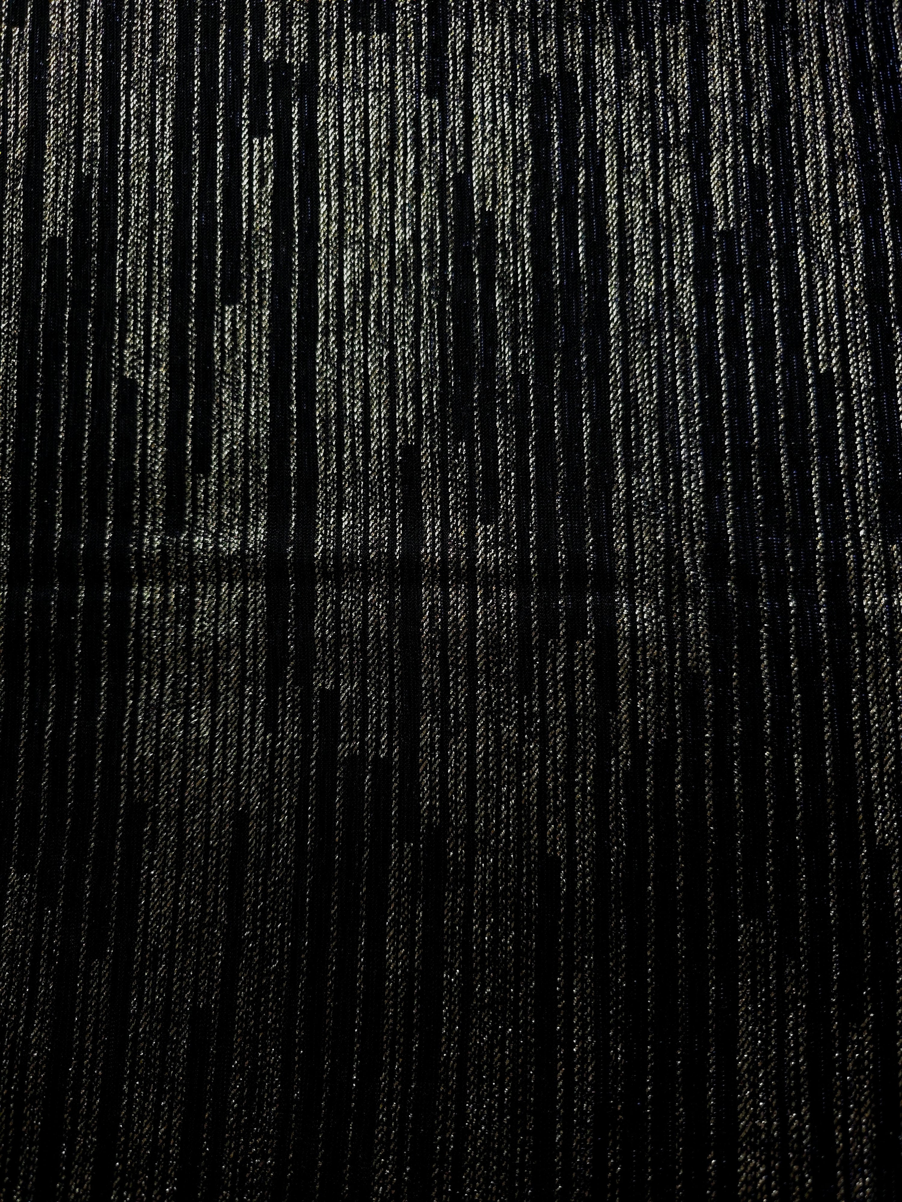 Surface view of Jet Black Sheer Metallic Shimmer Stretch Tulle Fabric showing even metallic shimmer, fine sheer tulle texture, translucent finish and stretch for overlays, dresses and performance wear