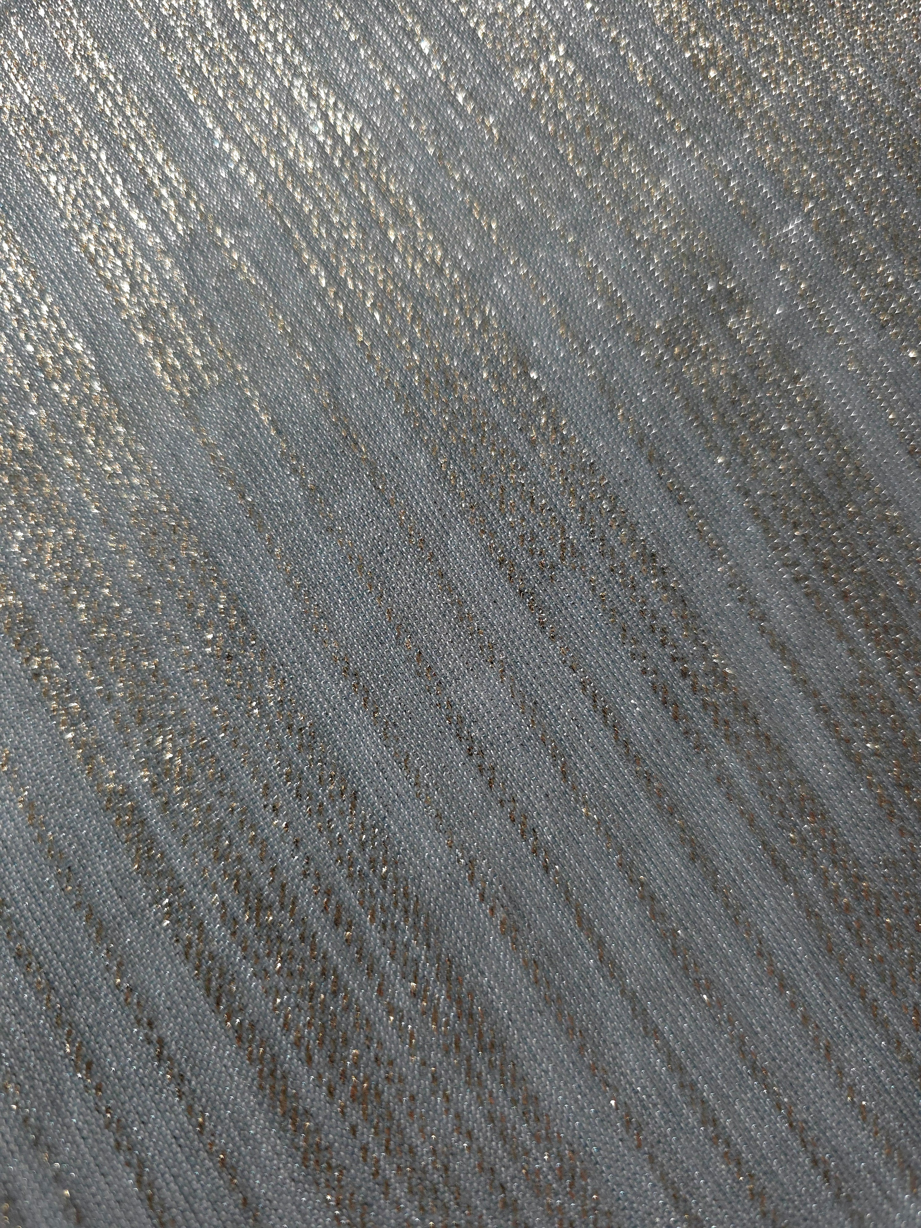 Close-up of Pewter Gray Sheer Metallic Shimmer Stretch Tulle Fabric highlighting fine sheer mesh texture, metallic shimmer, lightweight stretch and subtle transparency for fashion and performance wear