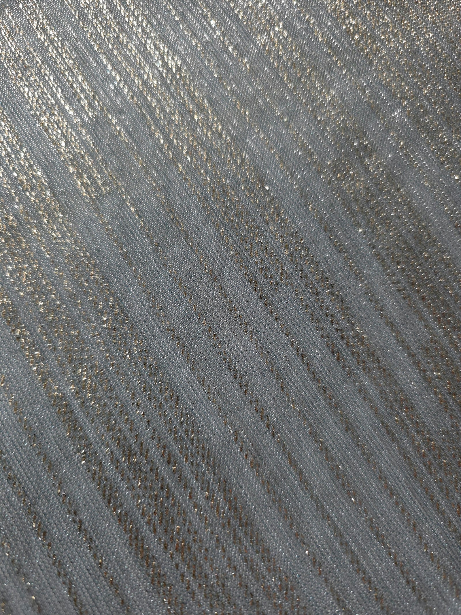 Close-up of Pewter Gray Sheer Metallic Shimmer Stretch Tulle Fabric highlighting fine sheer mesh texture, metallic shimmer, lightweight stretch and subtle transparency for fashion and performance wear