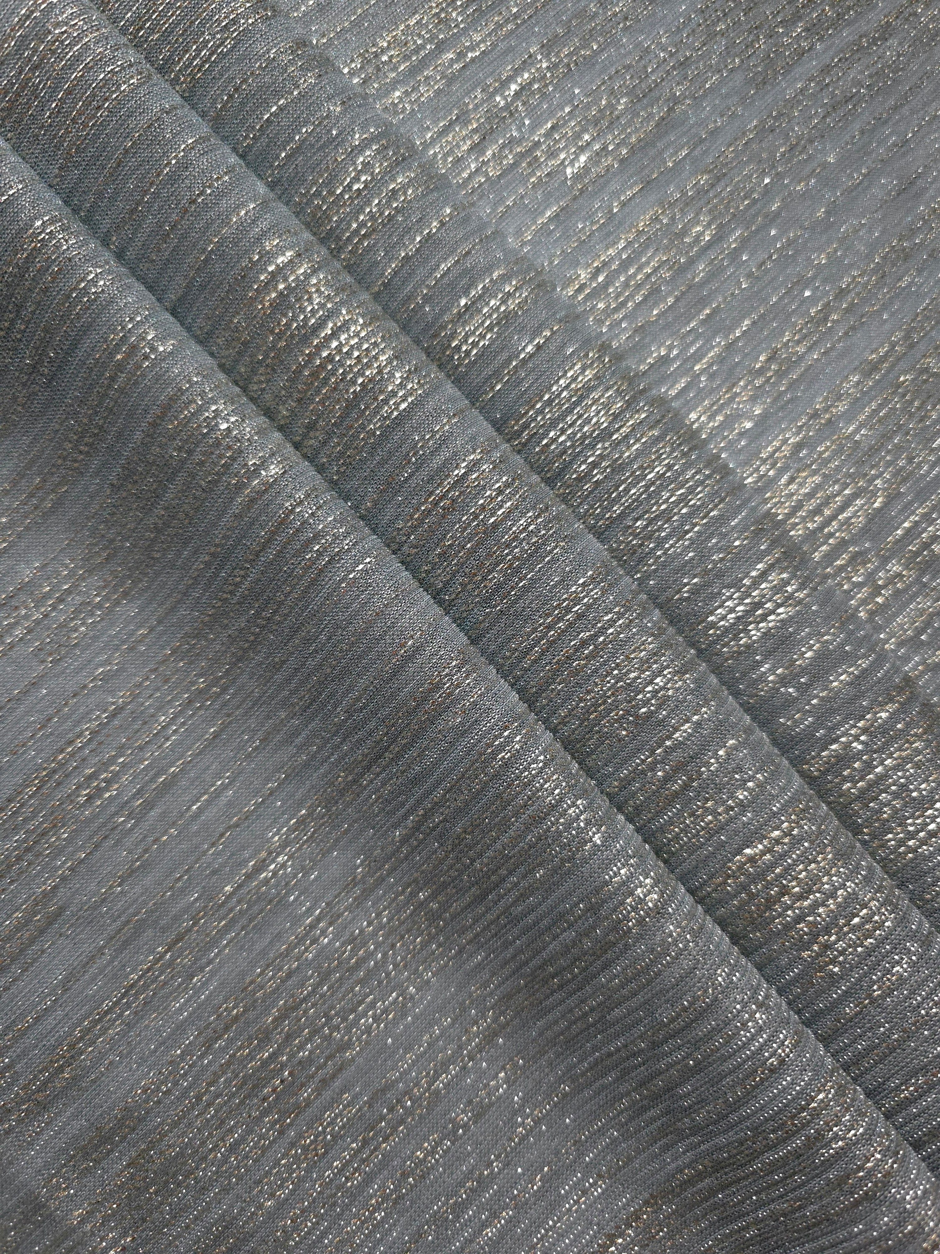 Layered Pewter Gray Sheer Metallic Shimmer Stretch Tulle Fabric showing shimmering depth, soft transparency and airy flexible folds for eveningwear, overlays, costumes and stagewear