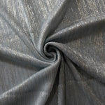 Swirl-draped Pewter Gray Sheer Metallic Shimmer Stretch Tulle Fabric showing fluid movement, reflective shimmer, airy transparency and flexible stretch for dresses, dancewear and stage looks
