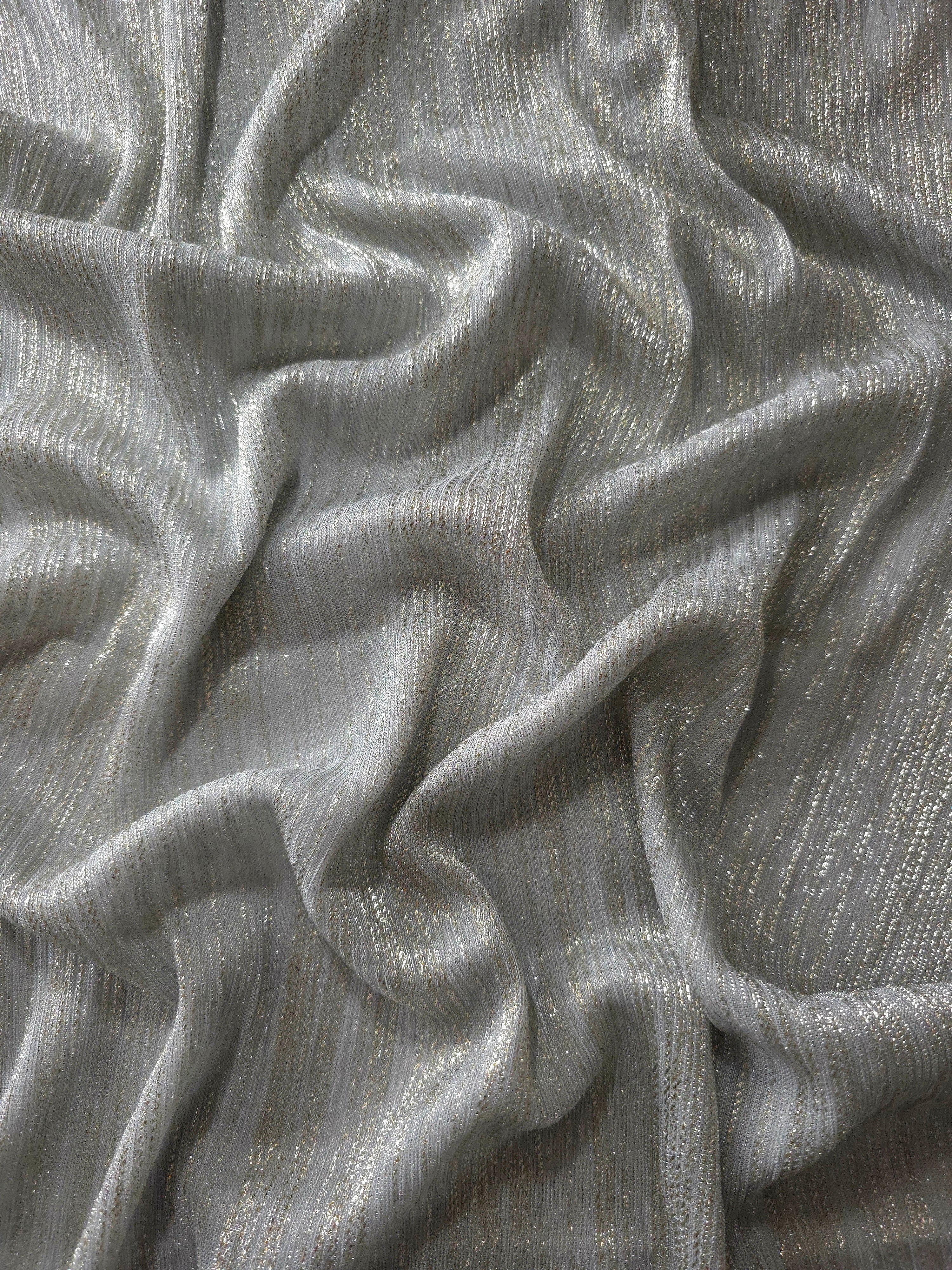 Draped Silver Gray Sheer Metallic Shimmer Stretch Tulle Fabric showing luminous reflective folds, soft transparency and flexible flow for dresses, dancewear, stagewear and occasion looks