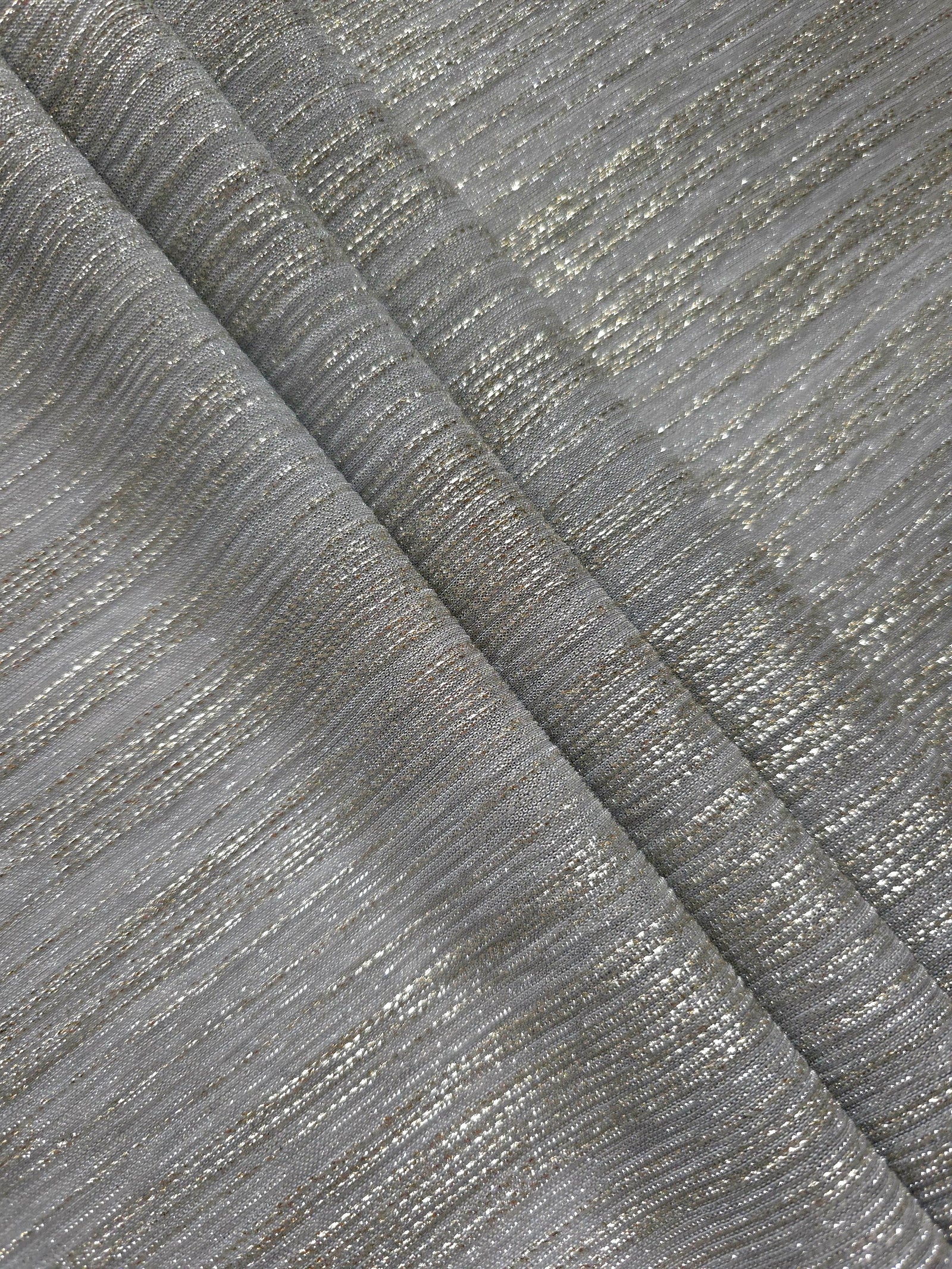 Layered Silver Gray Sheer Metallic Shimmer Stretch Tulle Fabric showing shimmering depth, soft transparency and airy flexible folds for eveningwear, overlays, costumes and stagewear