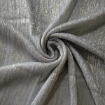 Swirl-draped Silver Gray Sheer Metallic Shimmer Stretch Tulle Fabric showing fluid movement, reflective shimmer, airy transparency and flexible stretch for dresses, dancewear and stage looks
