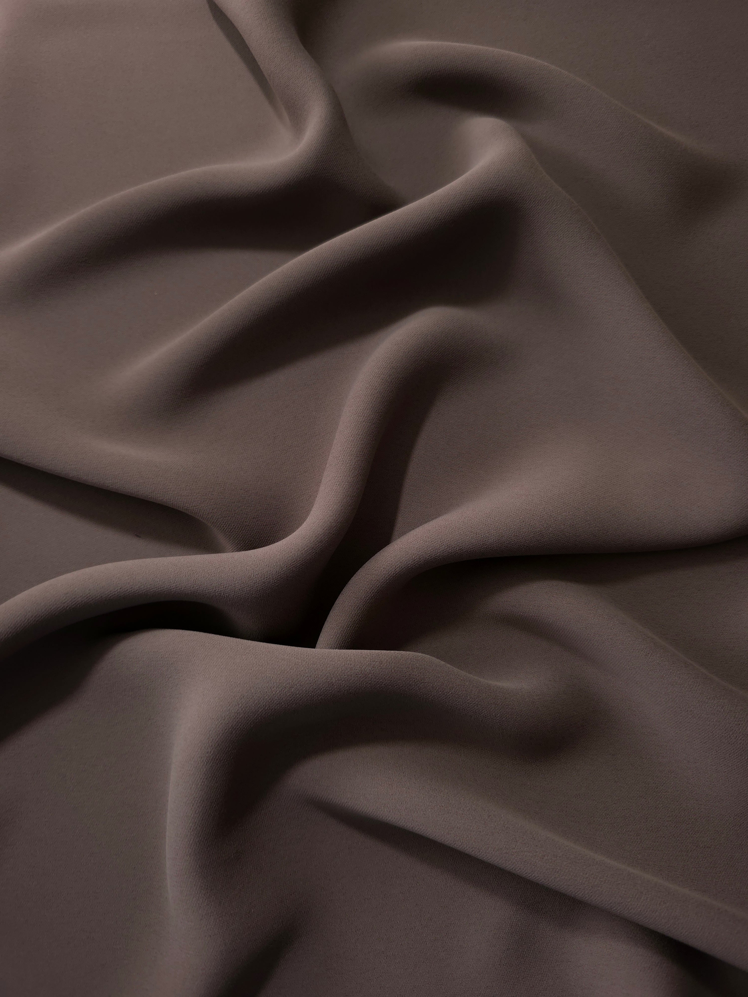 Long draped folds of Dark Cocoa Taupe Korean crepe showing opaque coverage for abayas, dresses and modest wear