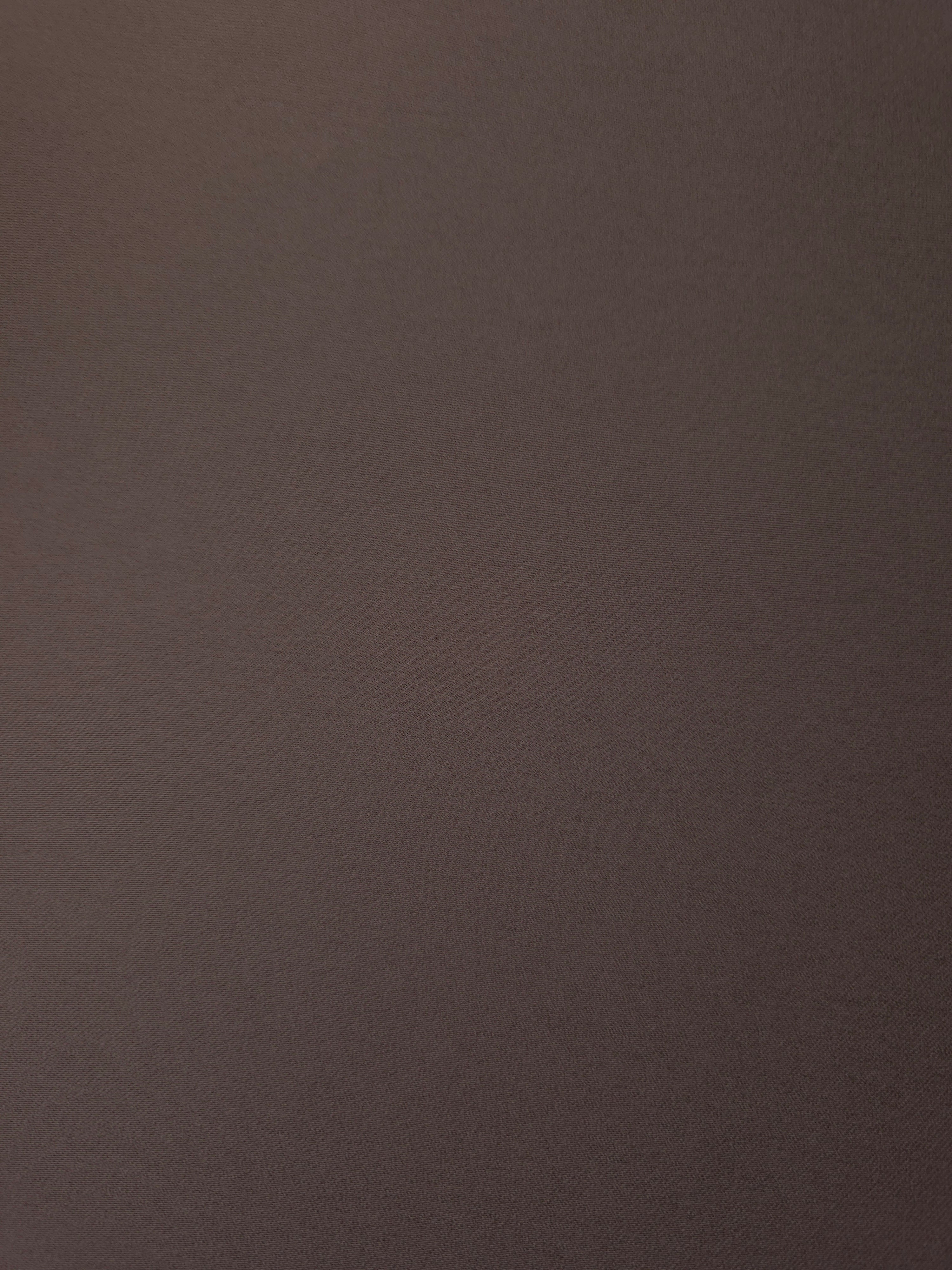 Fine texture close-up of Dark Cocoa Taupe 100% mechanical polyester crepe showing a smooth, silky-soft woven hand