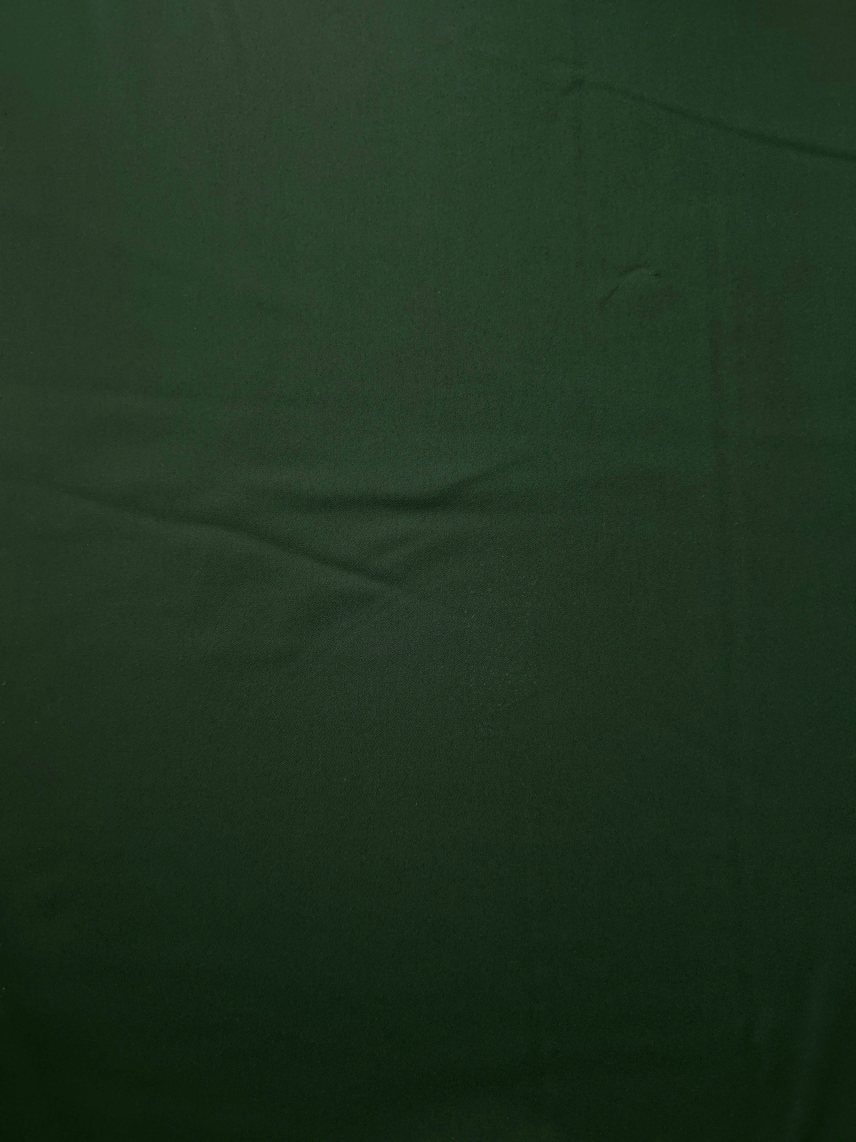 Dark Hunter Green polyester crepe shown flat, a smooth woven apparel fabric with a refined soft-touch finish