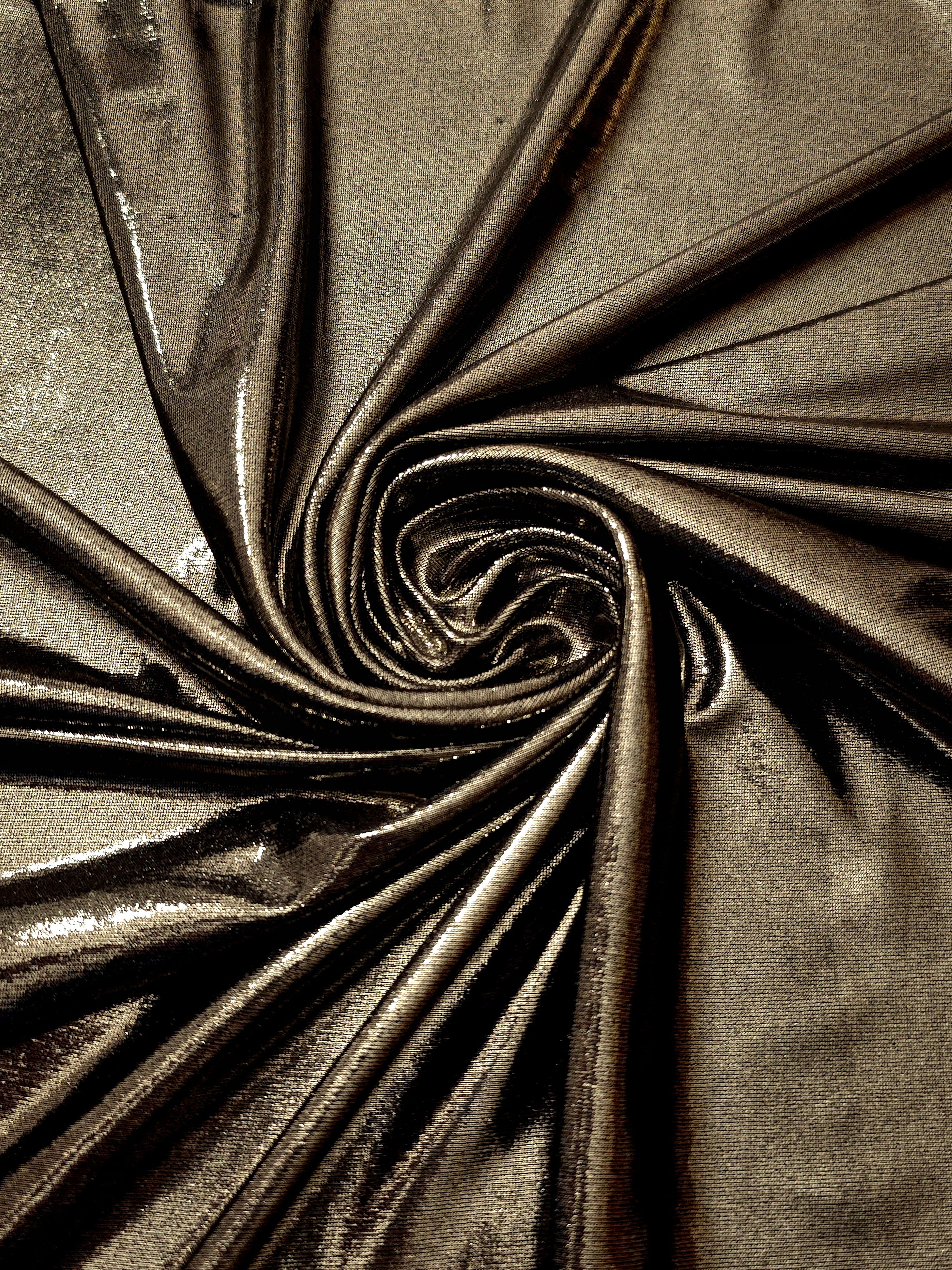 Dark Olive Taupe foiled spandex styled in a swirl, revealing metallic shine and flexible drape for dance costumes and occasion looks