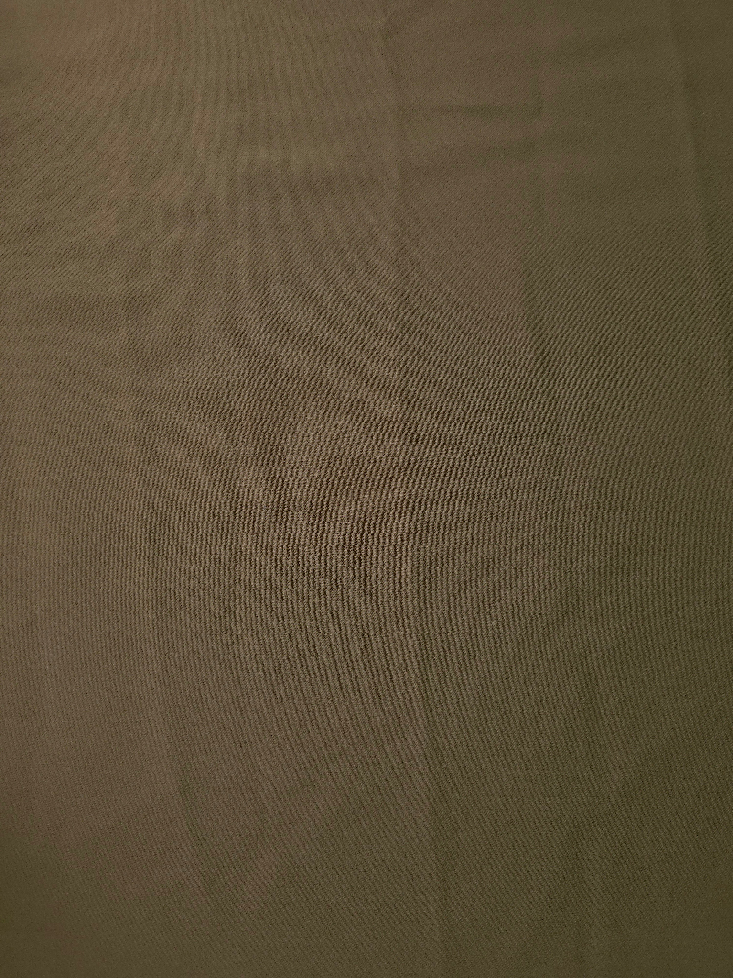 Dark Olive Taupe Italian polyester crepe shown flat, smooth woven apparel fabric for refined dressmaking