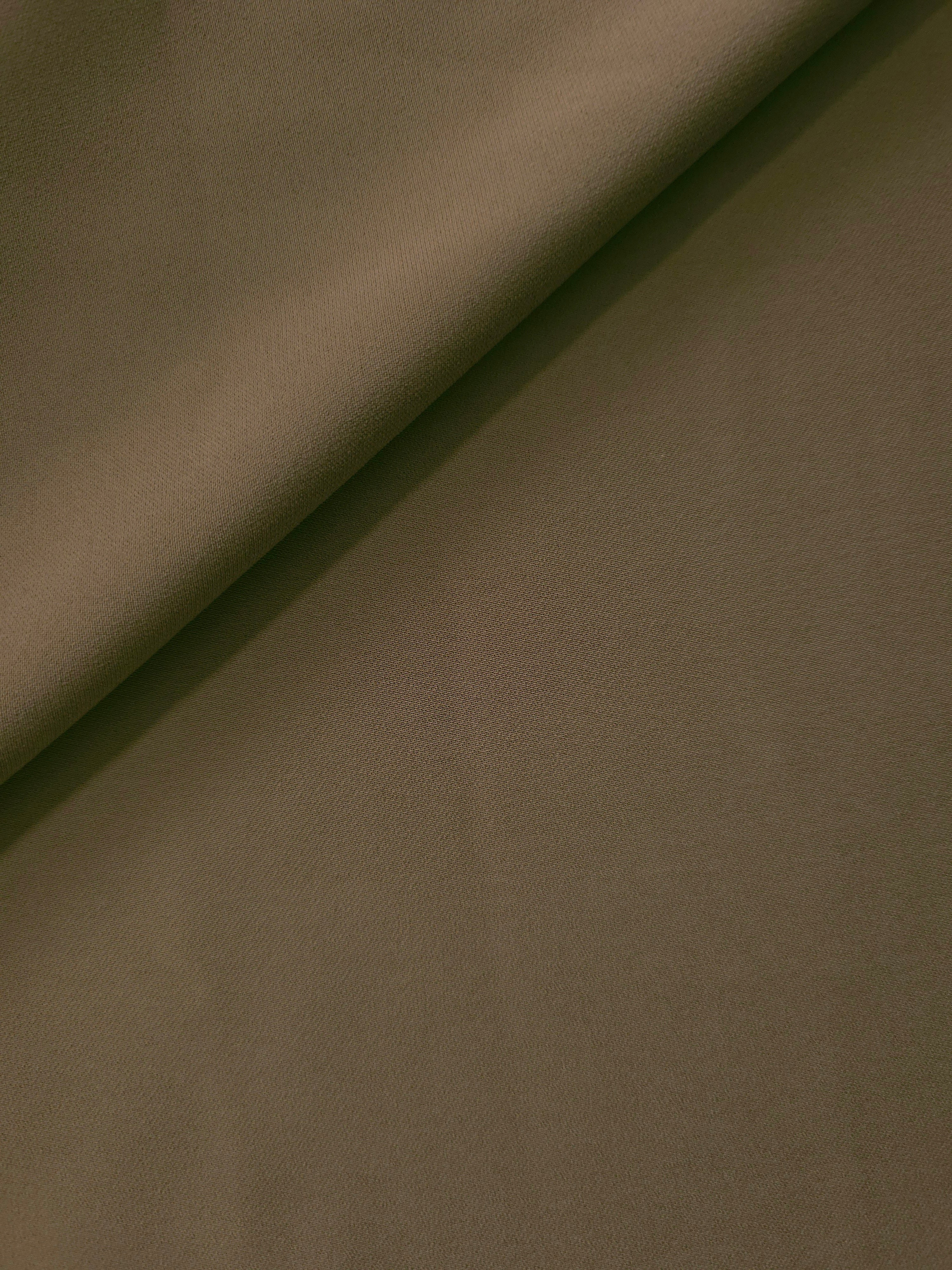 Dark Olive Taupe polyester crepe in a soft fold, showing fluid drape for dresses, blouses and elegant separates