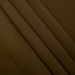 Dark Walnut Brown Korean crepe in layered folds, showing soft structure and slight mechanical stretch for skirts