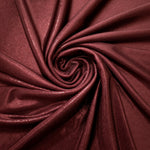 Spiraled Deep Burgundy shimmer spandex fabric showing reflective movement for evening dresses, costumes and performance apparel