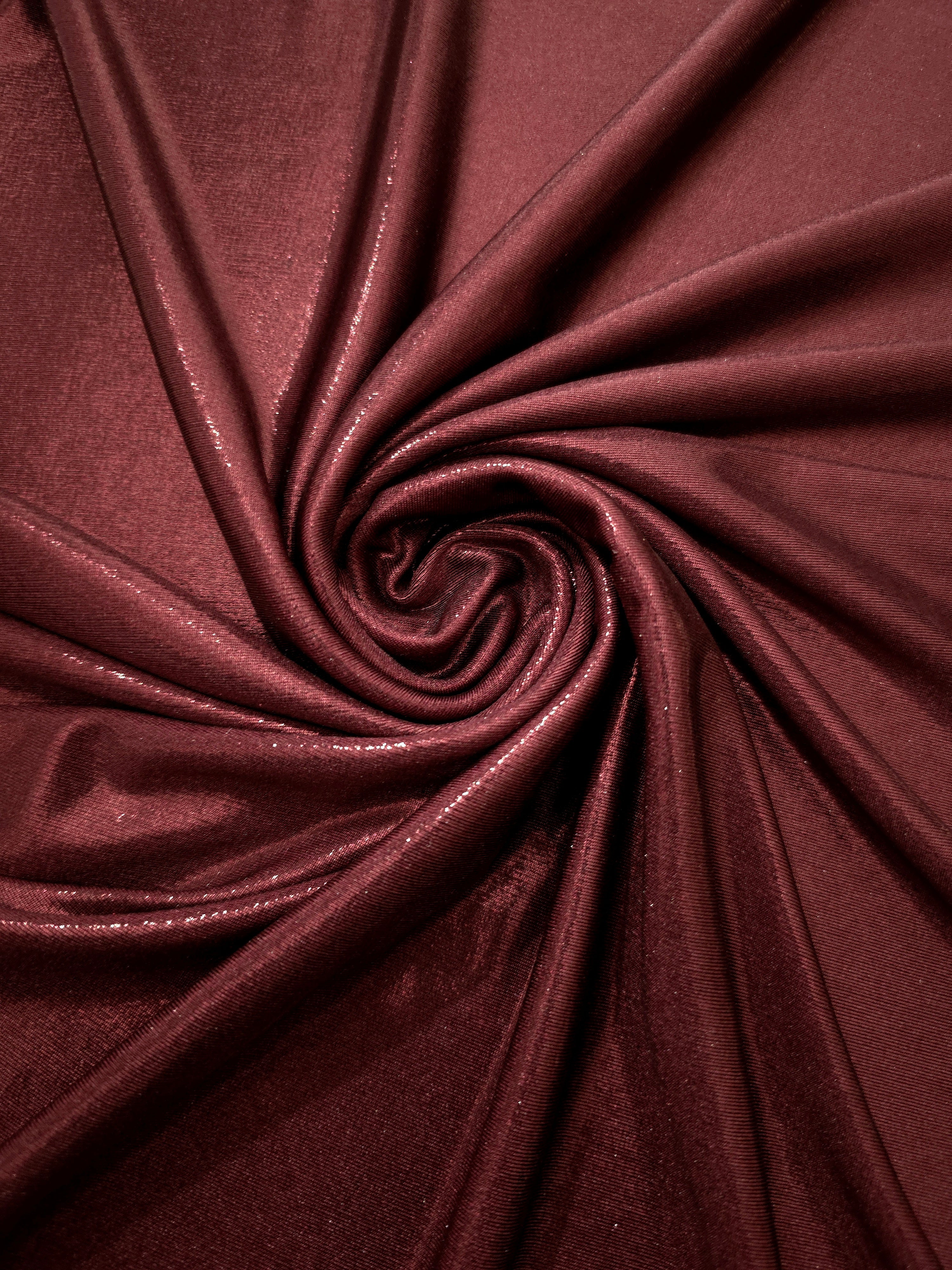 Spiraled Deep Burgundy shimmer spandex fabric showing reflective movement for evening dresses, costumes and performance apparel