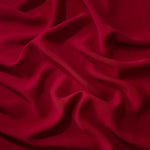 Deep Cherry Red polyester crepe in long draped folds, showing flowing coverage for abayas and modest fashion