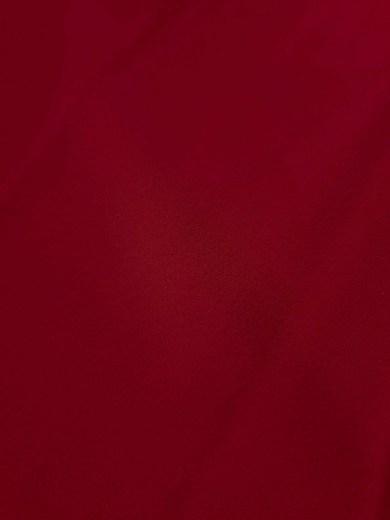 Deep Cherry Red Korean polyester crepe close-up showing the fine weave, smooth texture and silky-soft finish