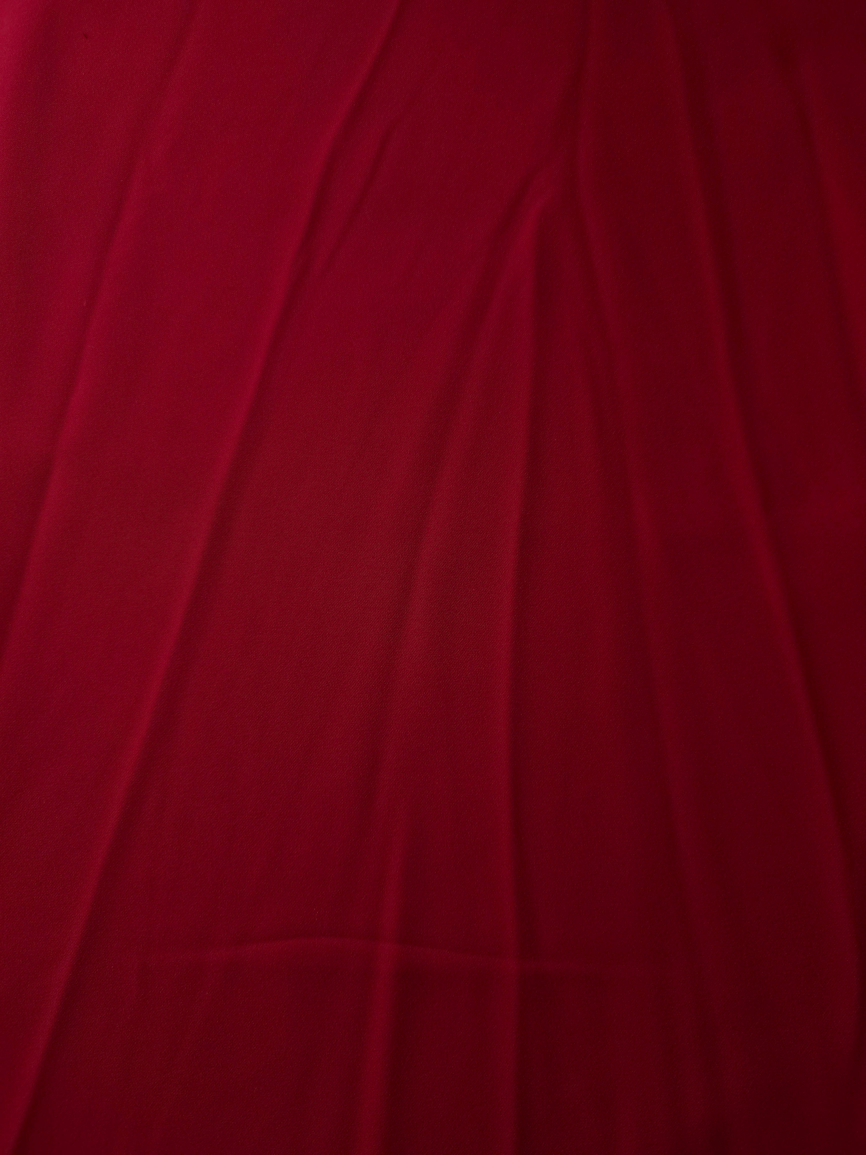 Flat view of Deep Cherry Red Korean polyester crepe, 205 GSM opaque dressmaking fabric with a smooth woven surface
