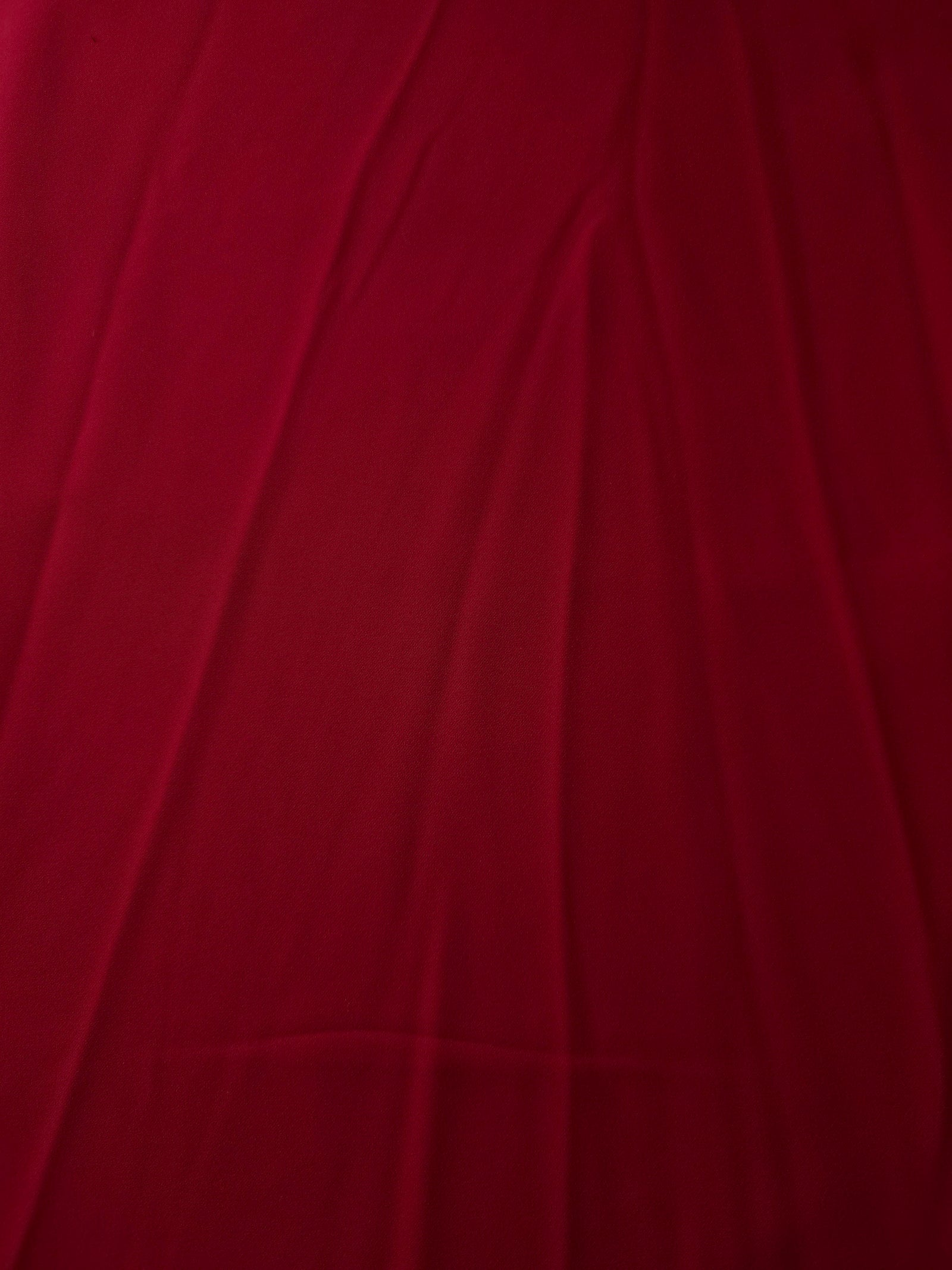 Flat view of Deep Cherry Red Korean polyester crepe, 205 GSM opaque dressmaking fabric with a smooth woven surface