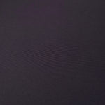 Close woven detail of Deep Eggplant Purple 100% polyester Korean crepe showing its smooth texture and soft finish