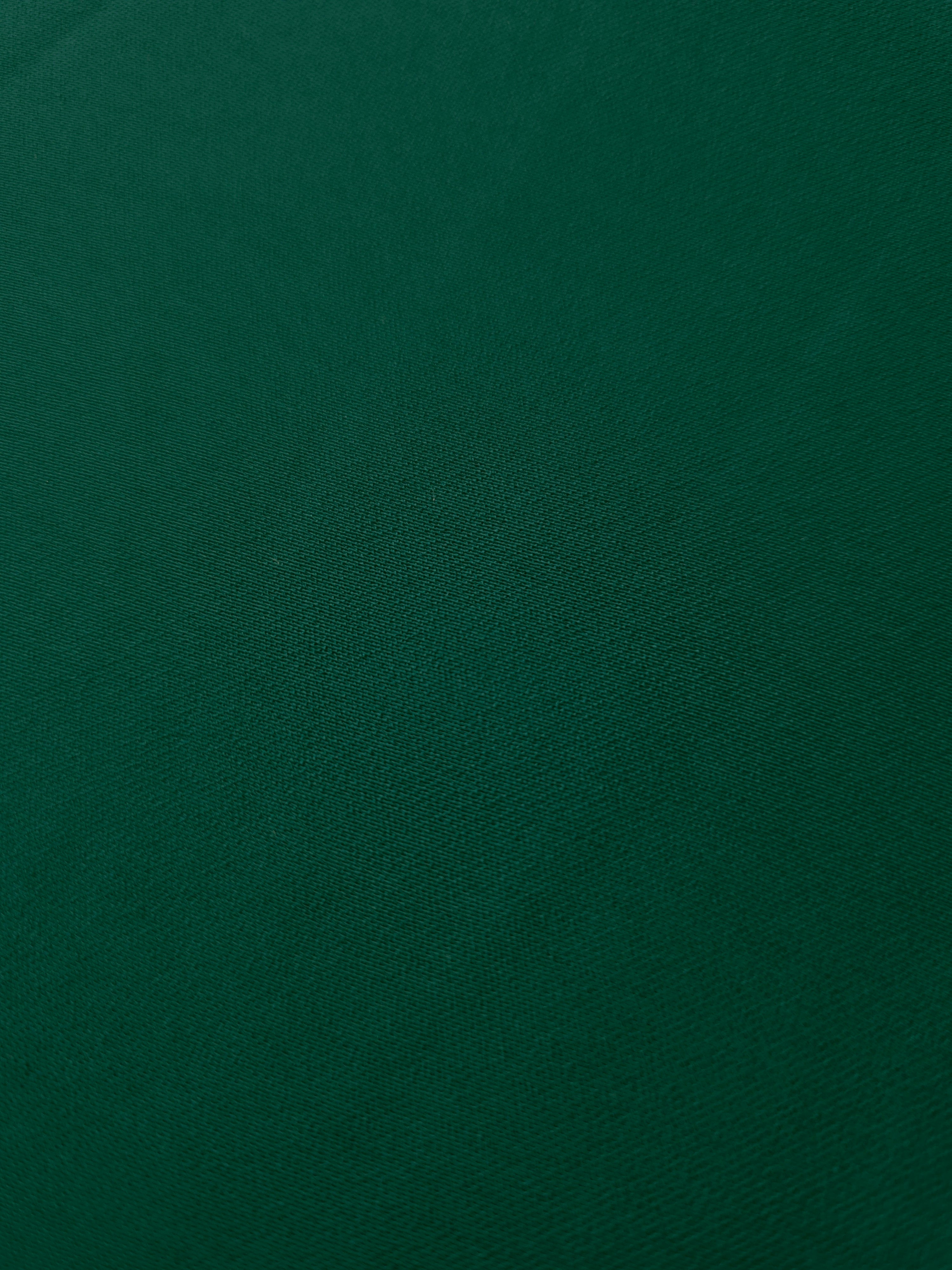 Deep Emerald Green mechanical polyester crepe in close-up, showing fine woven texture and a silky-soft surface