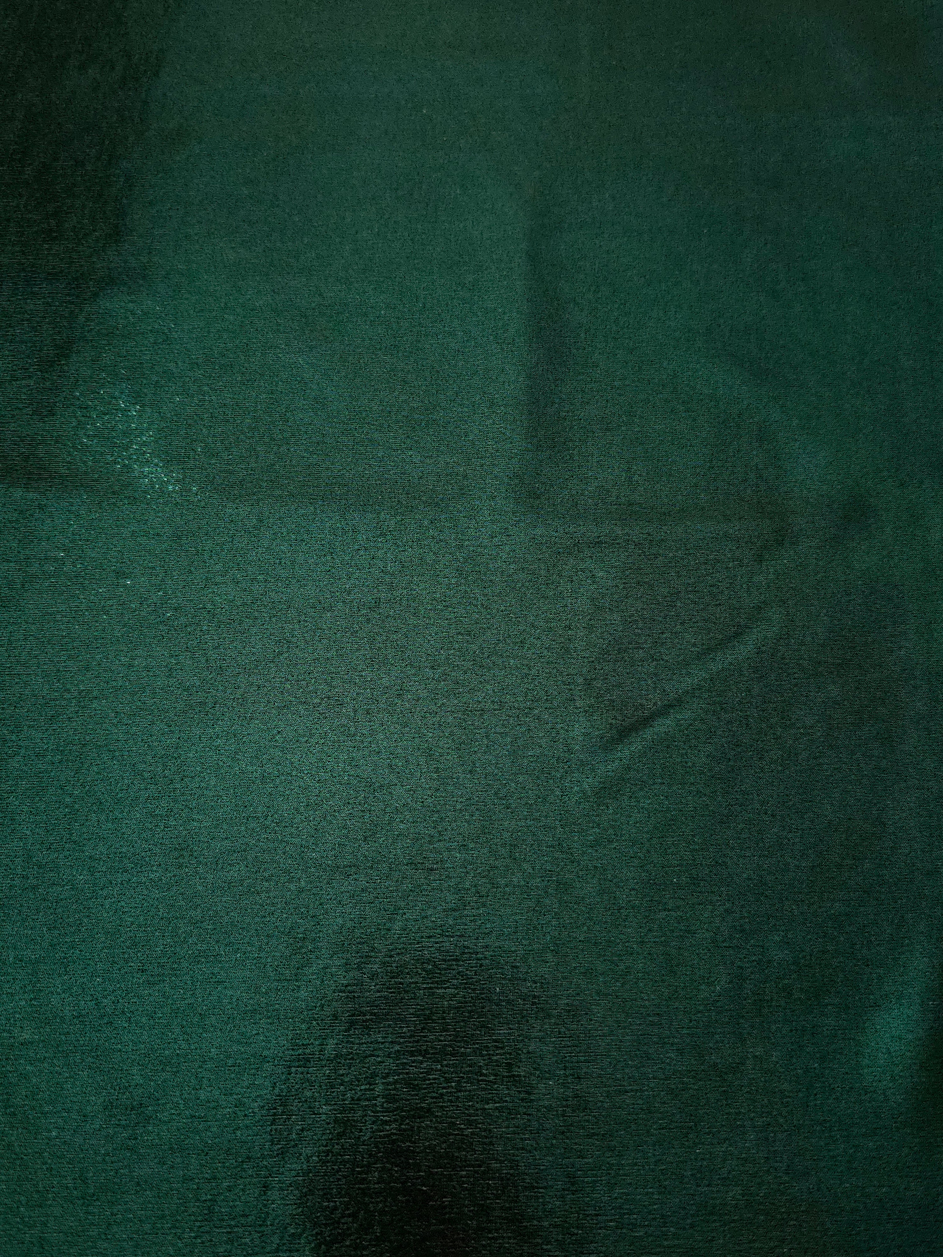 Flat view of Deep Emerald Green shimmer stretch fabric showing its metallic foil surface for costumes, partywear and fashion apparel