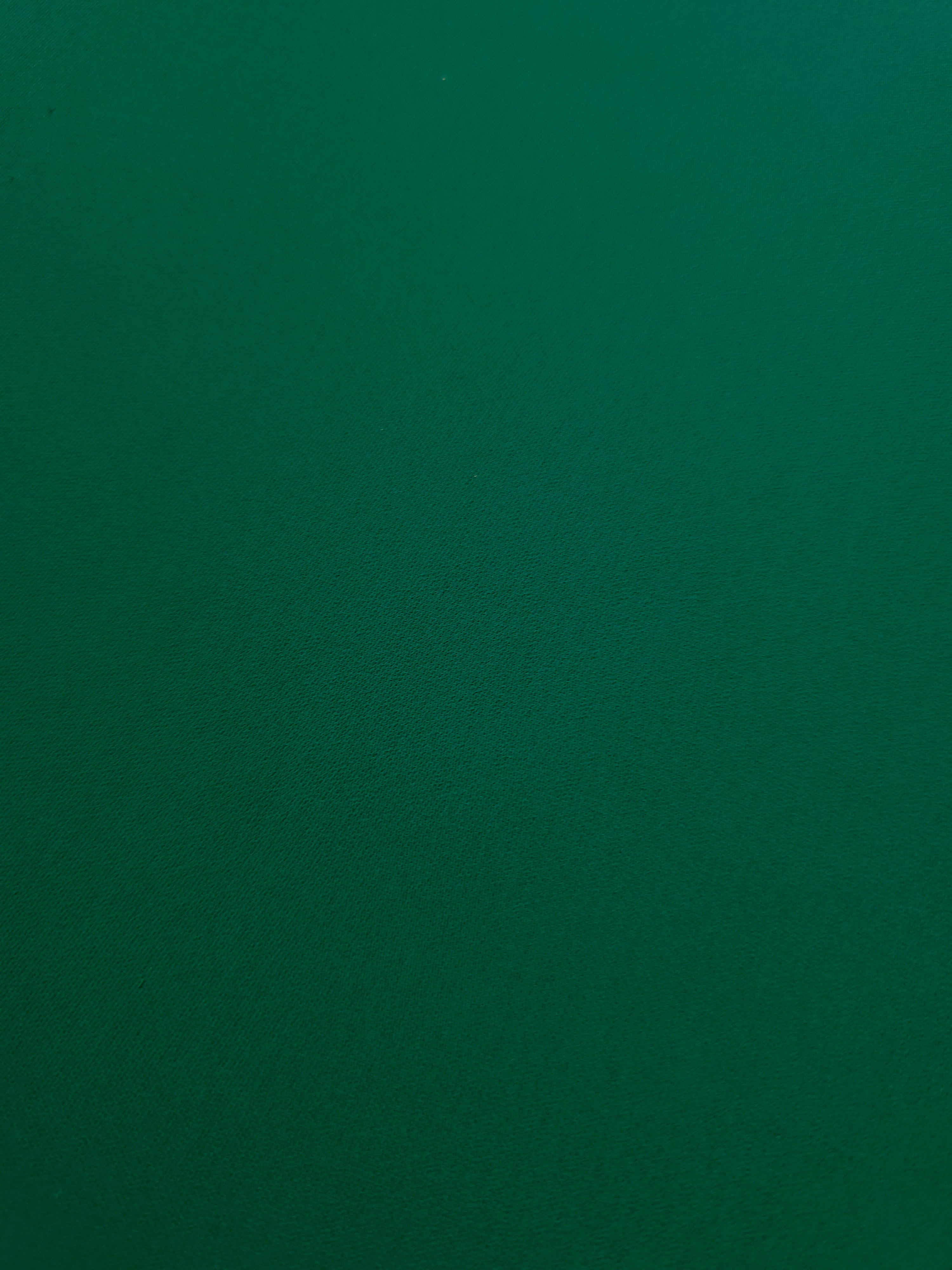Deep Jade Green mechanical polyester crepe in close-up, showing fine woven texture and a silky-soft surface