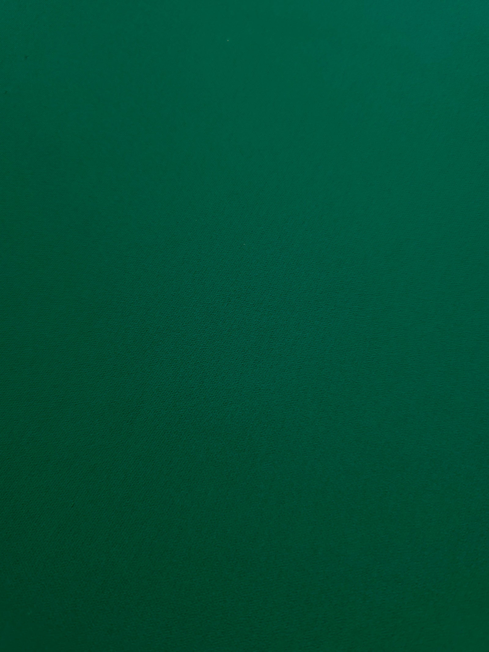 Deep Jade Green mechanical polyester crepe in close-up, showing fine woven texture and a silky-soft surface