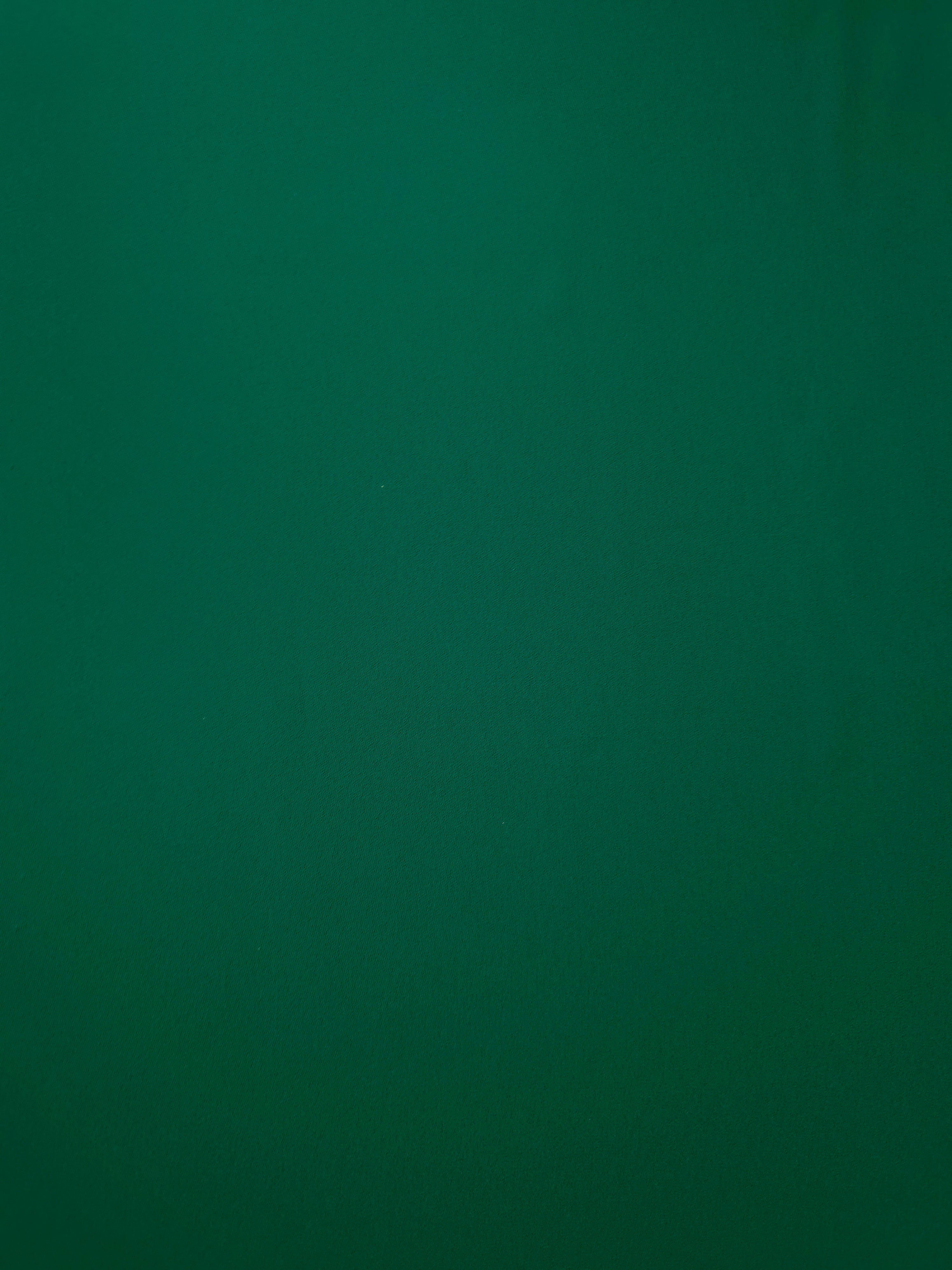 Deep Jade Green opaque Korean polyester crepe shown flat, 205 GSM smooth woven fabric for dressmaking