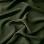 Deep Olive Green Korean polyester dress fabric shown in draped folds for occasionwear, blouses and dresses